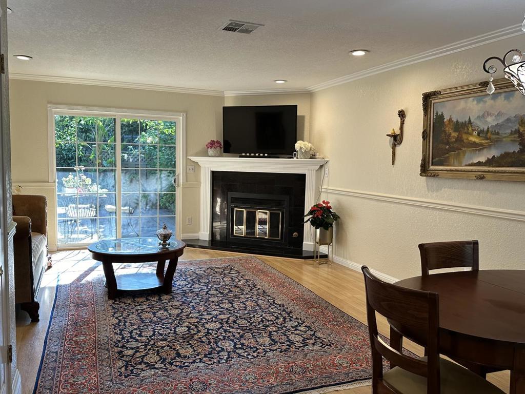 This remodeled condo in the quiet and private Eastgate community offers comfort and convenience. The spacious downstairs living room features a cozy fireplace, a half bathroom, and sliding doors leading to the backyard. The updated kitchen boasts recessed lighting, ample cabinet storage, and granite countertops, opening to a dining area. Upstairs, you'll find two bedrooms with mirrored closets, a primary bathroom, and a full-sized washer and dryer. Additional perks include central heat and air, two dedicated parking spaces near the entrance, ample storage throughout, and outdoor closets in the backyard and balcony. The community offers a pool, clubhouse, and HOA benefits, including exterior maintenance, water/sewer, and trash services. Enjoy a great commute location with easy access to freeways, shopping, restaurants, schools, Holiday Hills Park, and more!