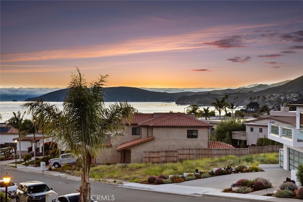 Welcome to your dream seaside retreat! Nestled in a beautifully maintained planned unit development, this split-level end unit offers outstanding ocean views from Point Sal to Port San Luis. Located on a quiet cul-de-sac near to both Palisade & South Palisade Parks as well as beach access, this home perfectly blends comfort, convenience, and coastal charm.
Property Features
• 3 Bedrooms | 2 Bathrooms | 1,665 Sq Ft
• Spacious split-level layout with vaulted ceilings and natural light throughout
• Deck with ocean views
• Cozy living room with fireplace and raised hearth
• Open kitchen with ample cabinetry and bar seating to dining area
• Primary suite with ensuite bath and walk-in closet
• Guest bedrooms with courtyard access
• Private courtyard with spa hookups (drain & electricity)
• Indoor laundry room
• Oversized 2-car garage + guest parking at your doorstep
Unbeatable Location
Enjoy access to the beach, surf, sand, and sunsets just minutes away. Explore nearby Avila Beach, Shell Beach & Pismo Beach. Fine dining, boutique shopping, water sports, golf courses, pickleball courts and world-class wineries – all at your fingertips.
Whether you're seeking a weekend escape, a full-time residence, or an investment in the coastal lifestyle, 101 Searidge has it all. Come experience the best of Central Coast living!