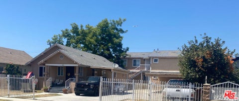 Photo of 1045 W 103rd Street, Los Angeles, CA 90044 (MLS # 26858217)