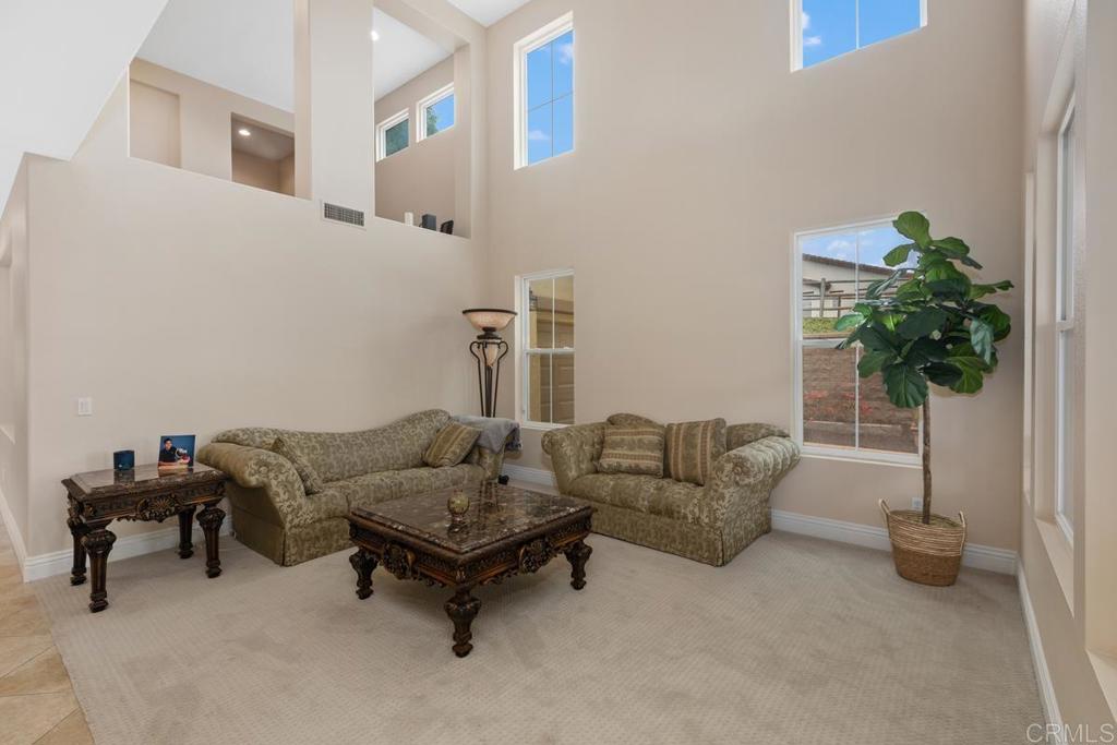 Gorgeous recently remodeled home in the heart of Otay Ranch One community. Private prime lot on cul-de-sac w/MIL suite dwn. Only 1 neighbor adjacent. Spacious open concept 5 bdrm, 4 bath w/large loft and playroom & den. 3 car tandem garage w/storage racks. Many upgrades, too many to list. Deluxe kitchen. Upgraded wood kitchen cabinets w/desk. Butler's pantry, walk in pantry. Kohler upgraded kitchen faucet. Porcelain 20X20 floors laid diagonally. Tons of storage space, large storage room under loft and under stairs. Long driveway. Professionally painted Dunn Edwards inside/out. New flooring 2nd floor in 4 bdrm's , hall, stairs, loft including master bath & huge master closet. Marble master shower/bath, Large tub. Laundry rm conveniently upstairs. Smart locks on 3 doors, ring doorbell, smart thermostats, dual A/C-heater. New quartz counter in 3 full baths. New mirrors/lighting in 3 full baths. Newer SS appliances. 7 ceiling fans (2 in patio) new living rm designer carpet. New carpet in coat closet/storage room. Dimmers throughout home. Covered front porch/back porch. Stamped concrete front/back newly refinished. Brand new garage door. Surround sound pre-wired throughout home. Alarm contacts on all doors/windows. Custom Brazilian granite fireplace. 20ft vaulted ceiling in living room. 16 ft ceiling in loft. Must see!! Close to Heritage Elem school. Walking distance to shopping Ctr/gas station. Otay Ranch Mall. Interstate 805/125 toll. Close to Downtown SD, Coronado/Imperial beach, Tijuana. Many parks, walking trails, comm pool, 24 roving patrol/guard's gate, community landscape included. 16 Solar panel lease $125. Buyer would need to assume loan. Majority of mello-roos will drop off next April 2026.