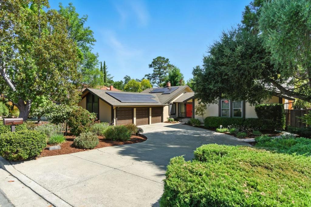 Premier Saratoga Single-Story Sanctuary. Welcome home to prestigious 95070, served by the acclaimed Cupertino schools- Kennedy Middle and Monta Vista High, as well as Blue Hills Elem. This expansive single-story roaming rancher residence offers space, privacy and comfort on a generous 12,500 SF lot. Vaulted ceilings and natural filtered light create a bright, warm, airy voluminous vibe, while garden views and mature specimen trees bring peaceful easy feeling. With five bedrooms and 2.5 baths, the very functional floor plan is ideal for extended families and entertaining alike. The updated kitchen and baths ensure a move-in ready comfort. Tranquility abounds as the back yard abuts to seasonal Calabazas Creek. Conveniently proximus to major tech HQ's, commute corridors, Westgate, downtown Saratoga's dynamic dining, Los Gatos, epic shopping, top schools, SJC. Rooftop solar, hot tub, waterfall, huge garden area, massive 3 car vaulted garage, specimen trees, shrubs and decks & patio This unique neighborhood quadrant has proven to be a high demand location for years due to many favorable factors. Lovingly owned since 1969, this home has been a haven of joy, serenity, and generational LOVE, ready to occupy by the next fortunate ownership. Do not miss the opportunity to live here!
