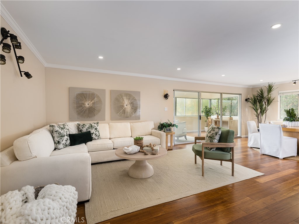 Discover the elegance of living at 5700 Ravenspur Drive, Unit 107, in the serene landscape of Rancho Palos Verdes. This 1,770-square-foot residence offers an inviting blend of style and comfort, featuring 3 spacious bedrooms and 1.75 elegantly designed bathrooms. The sophisticated interiors showcase the high ceilings, recess lighting, custom cabinetry, and natural light from an array of large windows catering to a modern lifestyle.
The spacious living area opens to an enclosed patio -- perfect for an office, study area, or workout space. Engineered hardwood floors are found throughout the home.
The kitchen is lined with updated cabinetry, stainless-steel appliances, and granite countertops with a peninsula, which is a great place for breakfast. A dining area can be found in the kitchen or off the living room.
The large primary bedroom has an electric fireplace, double custom closets, ensuite bathroom along with a built-in cabinet for the highly coveted in-unit laundry. One of a few units in the building with an electric washer/dryer hookup. No need to use the communal laundry.
Residents can enjoy a wealth of luxurious amenities, including a communal pool and spa for relaxation. The secured 33-unit building ensures convenience with an elevator and laundry facilities on each floor, while two assigned side-by-side parking spots in a gated garage offer ease for your commuting needs.
This one-level condominium is a sanctuary of tranquility with the garden views, perfectly capturing the essence of upscale living. It's located near shopping centers, restaurants, and award-winning Peninsula schools.