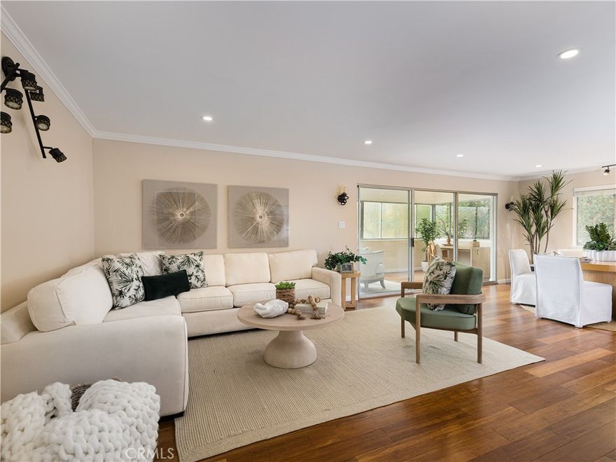 Discover the elegance of living at 5700 Ravenspur Drive, Unit 107, in the serene landscape of Rancho Palos Verdes. This 1,770-square-foot residence offers an inviting blend of style and comfort, featuring 3 spacious bedrooms and 1.75 elegantly designed bathrooms. The sophisticated interiors showcase the high ceilings, recess lighting, custom cabinetry, and natural light from an array of large windows catering to a modern lifestyle.



The spacious living area opens to an enclosed patio -- perfect for an office, study area, or workout space. Engineered hardwood floors are found throughout the home.



The kitchen is lined with updated cabinetry, stainless-steel appliances, and granite countertops with a peninsula, which is a great place for breakfast. A dining area can be found in the kitchen or off the living room.



The large primary bedroom has an electric fireplace, double custom closets, ensuite bathroom along with a built-in cabinet for the highly coveted in-unit laundry. One of a few units in the building with an electric washer/dryer hookup. No need to use the communal laundry.



Residents can enjoy a wealth of luxurious amenities, including a communal pool and spa for relaxation. The secured 33-unit building ensures convenience with an elevator and laundry facilities on each floor, while two assigned side-by-side parking spots in a gated garage offer ease for your commuting needs.



This one-level condominium is a sanctuary of tranquility with the garden views, perfectly capturing the essence of upscale living. It's located near shopping centers, restaurants, and award-winning Peninsula schools.