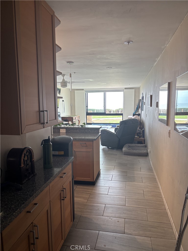 Owner is retiring and relocating from this prime ocean front location. The 1 bedroom 1 bath bright open floor plan is perfect for your home or an investment. Features high-end Travertine floor, granite countertop, brand new cabinets and breakfast bar. Front door secure entrance, private garage parking spot with storage, private court yard featuring a brand new gas BBQ grill and entertainment area, heat year around pool and hot tube, also large penthouse space available to all home owners. Just close from the beach, food and shopping. This is a must see!!