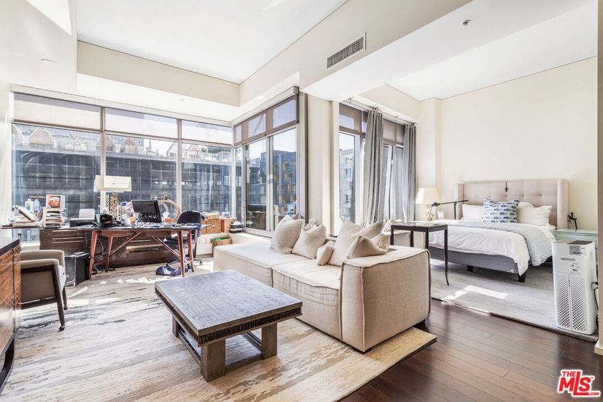 Spacious 1 bed/1 bath loft with separate dining/office area offered for lease in Evo South, the premier condo loft address in DTLA's South Park.  Daytime light pours into this 1,050 SF loft space through soaring east-facing windows that look out over S. Grand Ave.'s green treetops.  Inside, the loft features hardwood floors throughout, a modern kitchen with gas range and stainless-steel appliances, and exposed concrete columns for industrial edge.  Its long gallery entrance hall opens onto an airy main living area, large bathroom with tub shower, and separate storage room with stacked washer and dryer.  Evo pampers residents with an expansive pool, spa, and outdoor kitchen/dining amenities level conveniently located just one floor above this unit.  Amenities are continued on the rooftop with multiple fitness, exercise, and lounge areas boasting panoramic city views.  Evo provides 24-hour doorman security and concierge, gated assigned parking, and controlled fob access to each floor.  The building is located within the South Park BID whose safety ambassadors patrol the district's streets daily.  With easy access to the Expo Line, nearby restaurants, Whole Foods, Ralph's, shopping, and entertainment, this location is a "Walker's Paradise" (Walk Score: 92).  Available early May 2022.