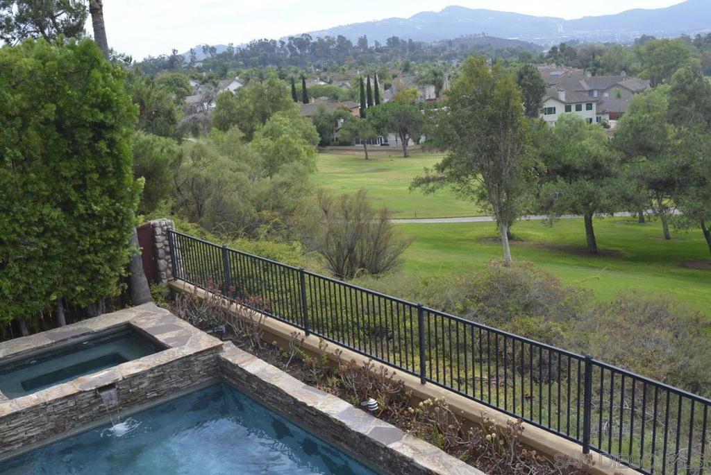 Step into a Luxurious lifestyle as you open the door to this well kept spacious home with incredible views and privacy. Set above the Twin Oaks Valley Golf Course enjoy the mountain views and tranquility of this well kept, gated home. You'll be drawn through the house to the backyard retreat with its perfectly situated pool and spa, a built in stone BBQ and a greenbelt for kids and animals to play. Inside, inlaws or guests enjoy a front downstairs bedroom/bathroom perfect for multi-generational living. A Chefs kitchen awaits with a large island, top tier appliances, and an abundance of storage. Surround sound in the open family room with large windows bringing in the views. 3 car garage yet one is a single stand alone space easily converted to an office, gym, dance or childs playroom, or theatre. The primary suite is its own wing and has a large bathroom with double sinks, double walk in closets and views that are even more spectacular. Use the Loft space as a large library or homework station and enjoy the balcony overlooking the pool and yard. Seller owned Solar, low HOA, Double Cul De Sac location on a quiet street this home has been thoughtfully designed for all ages, with EZ entrance doorways, wide hallways, and stylish, functional spaces for everyone! Wnd down with a book, gaming with kids, enjoy a drink with friends inside or out. Close to schools, restaurants, shops, and freeways.
