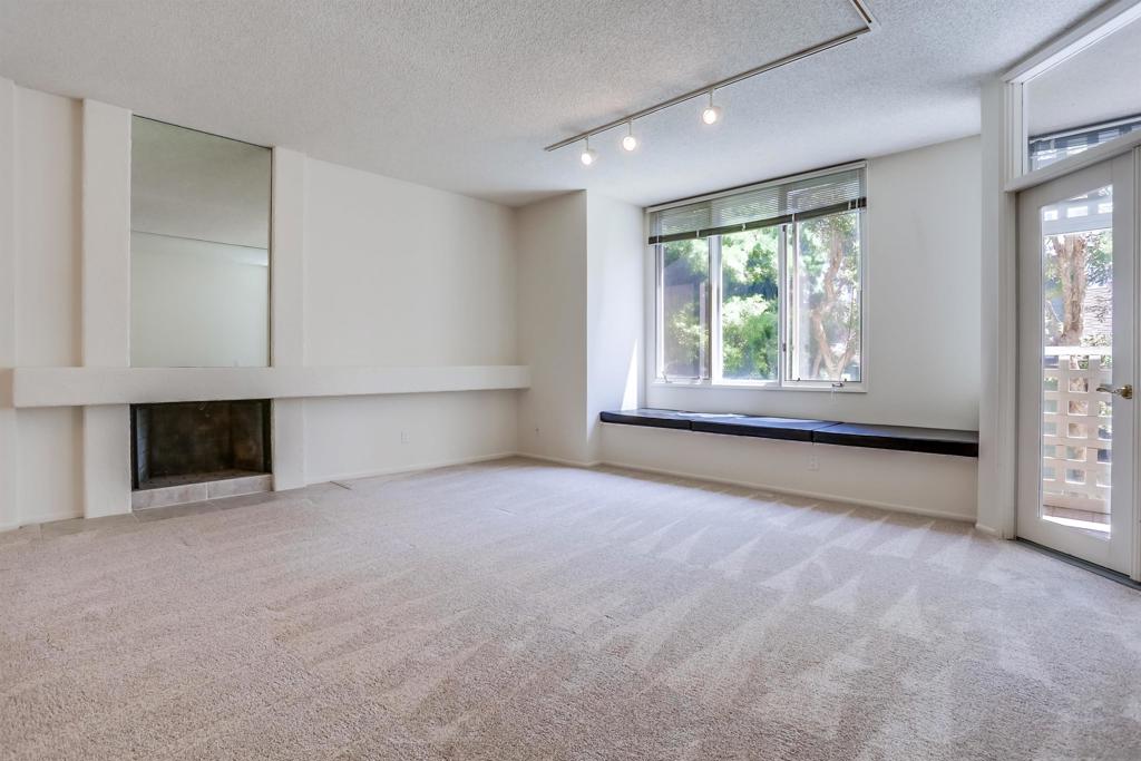 Quiet bright 2nd floor condo in great condition enclosed sun-room. Full kitchen appliances, tile counters, high ceilings, A/C, track lighting, full size washer & dryer, Hot water & trash included. 2 assigned parking spaces in under ground garage, very nice complex has pool, spa & tennis court. Close to UCSD shuttle stops, near Fwy 5 and UTC Mall. The spacious quiet unit in back of the complex not facing busy street, elevator close, peaceful relaxing huge water fountain sparkling at court yard & entrance.