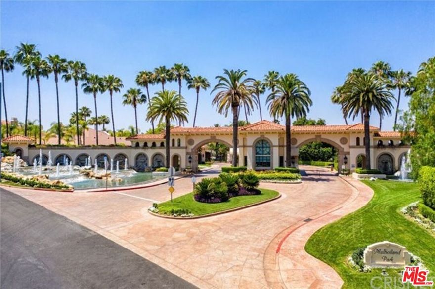 Located in the exclusive, 24 hour guard-gated community of Mulholland Park, this magnificent, double lot, 6-bedroom, 8-bath estate offers unparalleled luxury and privacy on an exceptional double flag lot spanning over 2.67-acres w/ expansive views! Highly desirable Plan 6 model. 100 ft Setback private driveway, oversized, & dual entry two car garages. Hand carved crown mouldings, attention to detail wainscotting, and so much more. Situated on a quiet cul-de-sac street, This expansive residence spans over 6000 square feet and features breathtaking panoramic vistas of the San Fernando Valley and The Mulholland Country Club. Key features are Floor-to-ceiling windows and multiple balconies capture panoramic views of the verdant golf course and the valley below. All creating a stunning backdrop for both daily living and special occasions. Grand-scale entertaining: The dual startcase formal entry opens to a dramatic great room with soaring ceilings, a formal dining area, and a spacious, modern kitchen with granite countertops and high-end appliances. All custom made dual wrought iron winding spiral staircase leads to all upper bedrooms, luxurious master retreat, complete with a cozy fireplace, his-and-hers private water closets, expansive walk-in closets, and private balconies overlooking the pool and valley. Generous living spaces: In addition to the primary suite, the home includes four large bedroom suites, all en-suite full baths with their own private balconies, a guest/maids' quarters, a private office, and a state-of-the-art movie theater. Park-like grounds: The home is set on a massive all usable lot providing a serene and private outdoor oasis. The grounds feature a pool, spa, entertaining areas, room for a sports court area, and an expansive lawn perfect for relaxing and enjoying the scenery. This property is a very unique and special "hand picked" lot, all oversized for large parties and entertaining with elegance and privacy.  Enjoy this offering as a truly magnificent living experience in one of Tarzana's most prestigious communities. A must see of a lot and prime location!