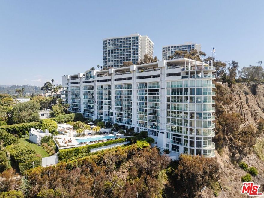Perched above the Pacific in Santa Monica's most prestigious oceanfront address, 101 Ocean, this extraordinary three-bedroom, three-bath residence has been reimagined in collaboration with Abramson Architects and Concept Design. Spanning nearly 3,000 square feet on a single level, the home embodies the elegance of a five-star resort, blending hand-selected designer finishes, sculptural lighting, and seamless indoor-outdoor living with panoramic views of the coastline, ocean, and Santa Monica Mountains. Walls of glass flood the interiors with natural light and extend to a generous ocean-view terrace, ideal for sunset lounging or al fresco dining. A striking Rift Oak feature wall anchors the living room, while a sleek stone-topped bar creates a sophisticated space for entertaining. The dining area, illuminated by a chandelier from A. Rudin, flows effortlessly into a chef's kitchen outfitted with Wolf and Miele appliances, slab-stone surfaces, temperature-controlled wine storage, and a built-in banquette for relaxed gatherings. Throughout the residence, statement lighting by Apparatus, Paul Ferrante, and Holly Hunt infuses each room with an artful glow, while Crestron home automation elevates modern convenience. The primary suite is a private sanctuary, complete with its own ocean-facing balcony, dual walk-in closets, and a luxurious ensuite with a custom-fabricated travertine shower and a freestanding soaking tub. Two additional bedrooms are designed with custom millwork by Swiss WoodWorking and open to a serene patio--one is appointed with a Porcelanosa-clad ensuite bath, while the other offers versatility with a concealed murphy bed, ideal as a media lounge, office, or guest retreat. Direct elevator access, artisanal stonework by Olympic Tile & Stone, and finely crafted details throughout further underscore the residence's sophistication. Within the exclusive enclave of 101 Ocean, residents enjoy a private resort environment complete with 24-hour doorman and security, along with direct beach access via an underground tunnel. Exceptional amenities include a sky lounge, ocean-view sundeck with a swimmer's pool, spa, and an outdoor kitchen with a shaded dining pavilion. Lushly landscaped courtyards lead to state-of-the-art fitness and yoga facilities, organic gardens, and a dog run. All of this is set just moments from Montana Avenue's boutiques, the Third Street Promenade, and a short coastal drive to Malibu--making this home a rare opportunity to experience Santa Monica's most refined oceanfront lifestyle.
