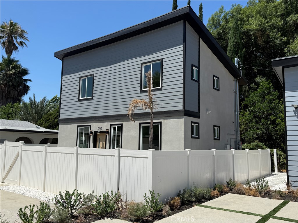 Brand new construction in tranquil Reseda Ranch! Be the very first to live in this beautifully designed, two-story detached ADU with solar, featuring 3 spacious bedrooms and 3 bathrooms. Gated for privacy, with its own private entrance and fully fenced yard, this modern home blends comfort, functionality, and contemporary style. Step inside to an open-concept main living space with woodgrain laminate flooring, recessed lighting, and large picture windows that flood the space with natural light. The entertainer’s kitchen is complete with granite countertops, sleek cabinetry, and stainless steel appliances. The downstairs level also features a private bedroom and bathroom with designer tile and a walk-in shower, plus an oversized washer and dryer for added convenience. Upstairs, the luxurious primary suite offers two closets and an en-suite bathroom with stunning finishes and modern tile. The third bedroom also features its own private bathroom, perfect for guests or a home office setup. Enjoy reduced energy costs thanks to installed solar panels. This beautifully landscaped and fenced property offers peace and privacy, yet is centrally located close to CSUN, public transit, shopping, dining, major freeways, and all the amenities the San Fernando Valley has to offer. Don’t miss your chance to lease this one-of-a-kind new construction home!