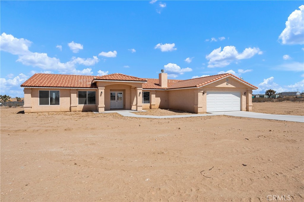 Step into style, space, and comfort with this stunning newly built 2024 single-story home in the heart of Phelan. Boasting 4 bedrooms, 2 bathrooms, and 2,007 sq ft of thoughtfully designed living space, this home combines sleek modern finishes with the serene beauty of high-desert living. The open-concept floor plan welcomes you with a bright living room anchored by a stylish fireplace, leading seamlessly into a chef’s kitchen with brand-new appliances, generous counter space, and a dining area perfect for entertaining. A private laundry room keeps your household running smoothly, while the spacious bedrooms offer comfort and flexibility for family, guests, or a home office. Enjoy the fresh air and sweeping desert and neighborhood views from your own expansive lot—over 2 acres of possibilities for gardening, animals, outdoor living, or future additions. With central air, a 2-car attached garage, and a peaceful location just minutes from local amenities, this home is truly the perfect blend of modern convenience and rural tranquility.