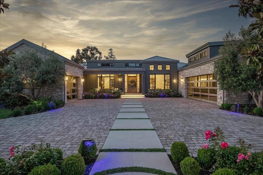Tucked in one of the most coveted enclaves of North Los Altos, this striking 2022 Napa-inspired modern estate offers over 6,100 SF of bold yet inviting living space on nearly 1/2 acre. The main home includes 4 spacious bedrooms + ensuite bathrooms, and is designed for seamless indoor-outdoor living. Pocket cantina doors open the great room to an expansive covered lounge space w/ fireplace, built-in BBQ, motorized screens, and surround sound. The show stopping kitchen features dual islands, custom cabinetry, and high-end appliances. The stunning primary suite showcases a steam shower, soaking tub, dual vanities, private patio, and designer walk-in closet. Resort-style amenities include a UV-filtered pool and spa, bocce court, and a dedicated dog run with pet wash access from the laundry room. A detached ADU/pool cabana offers a full kitchen, bathroom, and backup power. The expansive lower level features a quartzite backlit bar, wine cellar, theater, guest suite w/ kitchenette, and separate utility/laundry room. 2-car epoxy-finished garage with custom cabinetry plus detached two-story garage with car lift. Fully integrated Control4 smart home. Located near top-rated Los Altos schools, downtown, tech campuses, and commuter routes. Don't miss this one-of-a-kind modern legacy estate.