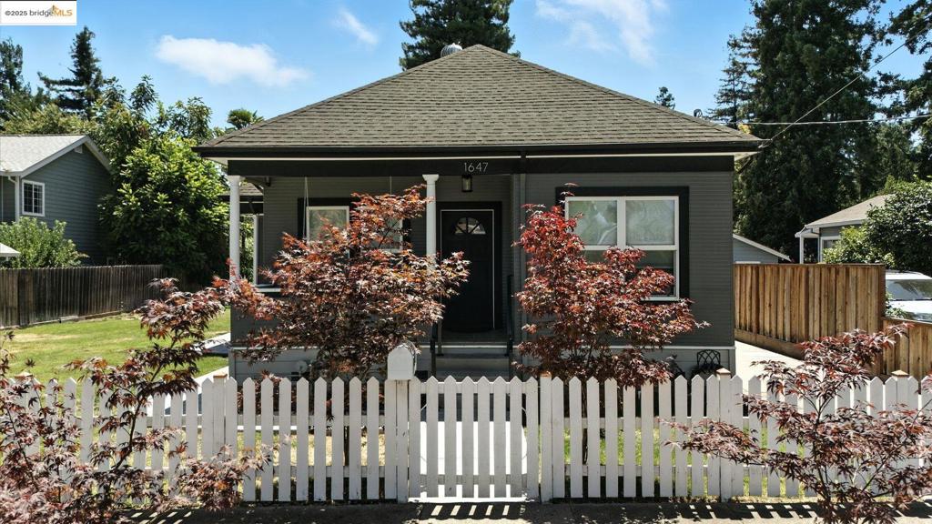 This charming single-family home is a delightful blend of historic character and modern convenience. Originally built in 1900, this residence features 3 bedrooms, 1 bathroom, and a bonus room with an additional bath. Nestled in the coveted Alphabet Street neighborhood, this home is perfectly situated within walking distance to downtown Napa, providing easy access to vibrant shopping, dining, and cultural experiences. The property sits on a quiet dead-end street with a picturesque creek, offering a serene and private setting ideal for families with children or those seeking a peaceful retreat. Newly renovated, the home boasts extensive updates while retaining its unique charm. Recent enhancements include new hardwood flooring in the main living area, alongside a remodeled kitchen and bathroom with updated countertops, backsplash, cabinet doors, and fixtures throughout. The home has also undergone comprehensive paint jobs both inside and out, as well as updated plumbing and electrical systems. The bonus room has been significantly upgraded with a full bathroom remodel, lifeproof vinyl flooring, fresh paint, and updated doors. The spacious yard, with its newly leveled terrain and sprinkler system, provides ample room for entertaining, any garden, pool projects, or an ADU.