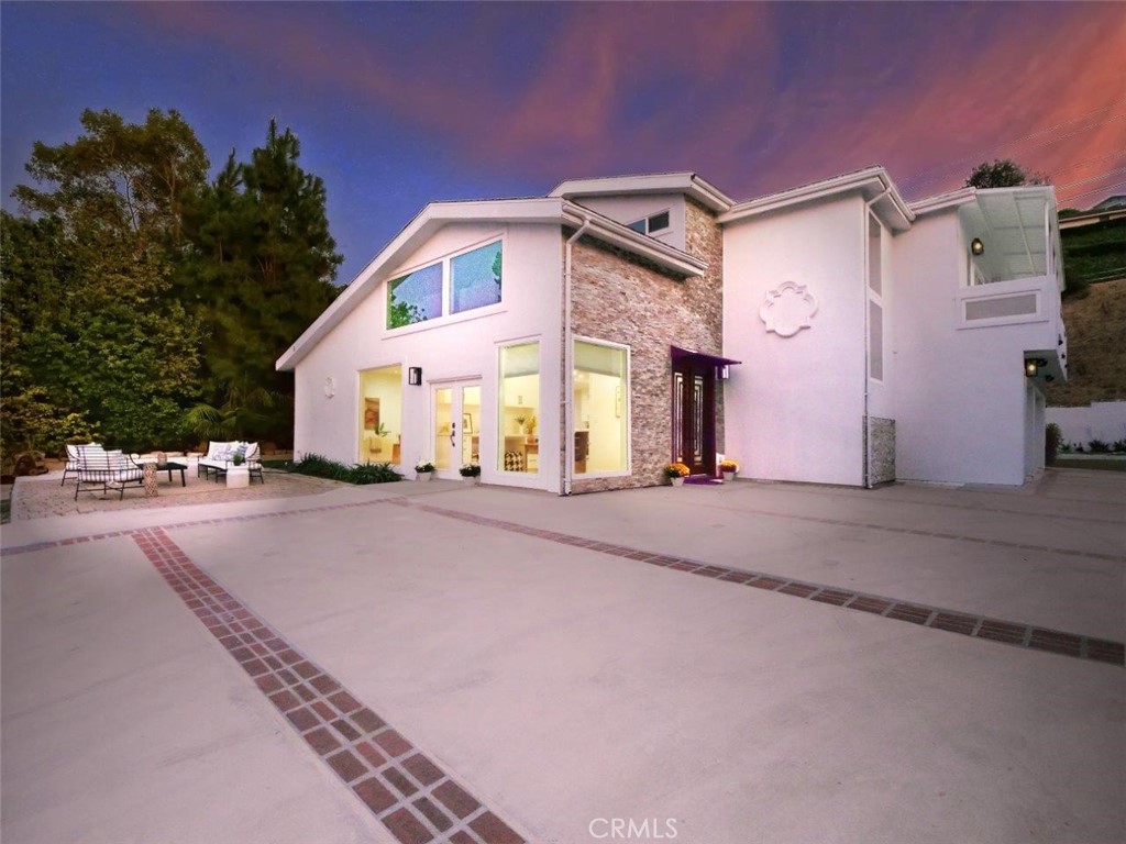 Beautifully renovated and incredibly versatile, 5 Cayuse Lane presents a unique opportunity in a quiet, desirable neighborhood located within a top-performing school district. This generously sized property includes a 3,605 sq. ft. main residence and an attached 1,500 sq. ft. guest house, ideal for extended family, visiting guests, or even as a potential rental.
The main home offers 3 bedrooms, 5 bathrooms, a dedicated office, a spacious den, and a multi-purpose bonus room that works perfectly as a home gym, playroom, or yoga studio. The thoughtfully redesigned interior showcases a chef’s kitchen with top-of-the-line appliances, ample workspace, and an open-concept flow that connects seamlessly to several living and entertaining areas.
Upstairs, a sunlit living space offers serene port views, creating a peaceful setting for everyday living. Each bathroom is appointed with spa-inspired finishes, and the bedrooms provide both comfort and seclusion.
The attached guest house includes 2 bedrooms, a stylish kitchen, a full bathroom, a laundry area, and a separate entrance, perfect for multi-generational living or added income.
Tucked away on a private lane, this turnkey home features luxury finishes, and flexible living spaces. Properties with this level of quality and adaptability rarely come to market, don't miss your chance.