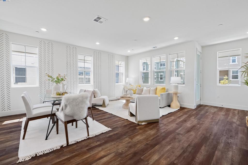 Welcome to this corner unit located in the desirable Bridgeway community of Newark. The northeast-facing orientation ensures that natural light floods the home throughout the day, creating a warm and welcoming atmosphere. This modern, smartly designed home offers 1,424 square feet of bright and inviting living space, perfectly blending style and comfort. As you enter, you'll be greeted by an open layout that seamlessly connects the living area with the sleek, modern kitchen. In the kitchen there are well-maintained stainless-steel appliances, upgraded kitchen island, and countertop with full backsplash. Luxury vinyl plank and carpet throughout the house. Enjoy the luxury of two covered patios, ideal for outdoor coffee, tea or simply unwinding with a good book. Bridgeway residents enjoy a host of amenities like a clubhouse, swimming pool, dog park, and playground. Nearby Don Edwards San Francisco National Wildlife Refuge offers open space with trails and nature to explore. Within good commute distance to schools including private schools like Challenger and Stratford. Close to Meta and Tesla, among other major high tech employers. Easy access to Dumbarton bridge and I-880. Don’t miss the opportunity to make this bright and beautifully designed property your new home.