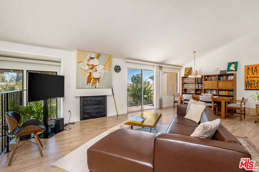 Welcome to the highly coveted neighborhood of Porter Ranch! This beautiful 3 bedroom, 2.5 bathroom home offers modern comfort with thoughtful updates throughout. The incredible kitchen, equipped with ample cabinet space and a brand-new induction stove opens to the spacious living room centered around a cozy gas fireplace. Soaring vaulted ceilings and sliding glass doors flood the home with natural light and lead out to your balcony. The unit is quiet and private, perfect for someone who works from home. The primary suite easily accommodates a king-sized bed, features an ensuite bathroom, and opens up to a private back patio. Two additional bedrooms are located on either floor. An attached two-car garage offers convenience with direct ground-floor access, laundry with new stacked washer/dryer, and plenty of storage. The home has been meticulously cared for. The recent upgrades include luxury vinyl plank flooring, fresh paint, new blinds, new dishwasher, new kitchen sink and garbage disposal, remodeled bathroom features including shower doors, new shower dial/head, and new sink dials/nozzles plus new toilets. Other improvements include a new garage door motor, ADT security system, hand railing restoration, and back patio tree removal. Mold and termite remediation were completed in 2022 for added peace of mind. The location is unbeatable with the 118 freeway and public transportation just blocks away. Surrounded by parks, hiking trails, endless shopping and dining, and the highly sought-after Porter Ranch School system, this home truly has it all. Don't miss taking a dip in the community pool on hot summer days or unwinding in the spa after a long week.