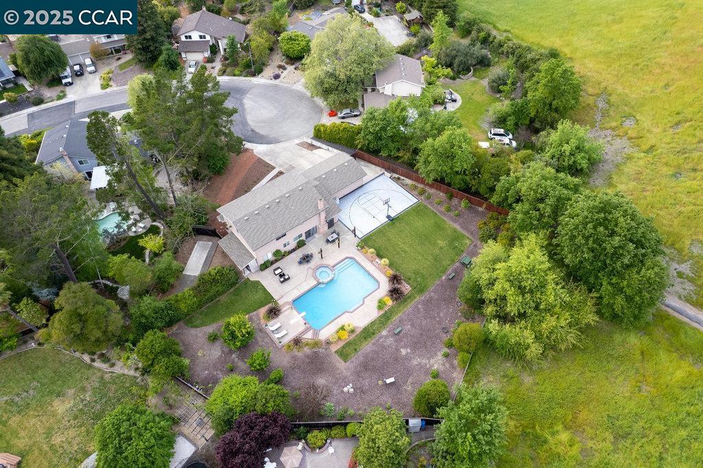 GREAT. BIG. YARD. 316 Zamora Place in Shadow Hills - where outdoor living is a lifestyle. Tucked at the end of a quiet court and surrounded by open space, this 5-bed, 2.5-bath, 2,660 sq ft home sits on a mostly level 0.45-acre lot. The expansive backyard features a 40x20 pool with sun deck, sport court, lush lawn, and fruit trees. There's room to add an ADU, outdoor kitchen, garden, or solar panels. Inside, the updated 2020 kitchen includes a custom Italian Fulgor Range with advanced settings, premium appliances, and soft-close cabinetry. A spacious family room, formal dining, and living room complete the downstairs. Four bedrooms, including the primary suite, are upstairs; one bedroom is on the main level. Enjoy RV/boat access on both sides, high ceilings in the 3 car garage (lift potential), and parking for 8+ cars on the driveway. Major updates: 2016 composite roof, 2024 HVAC, and 2020 upstairs bath. Located in sought-after Shadow Hills with access to top SRVUSD schools: Greenbrook Elem, Charlotte Wood MS, and SRV High. This home offers a great combination of space, function, and location.