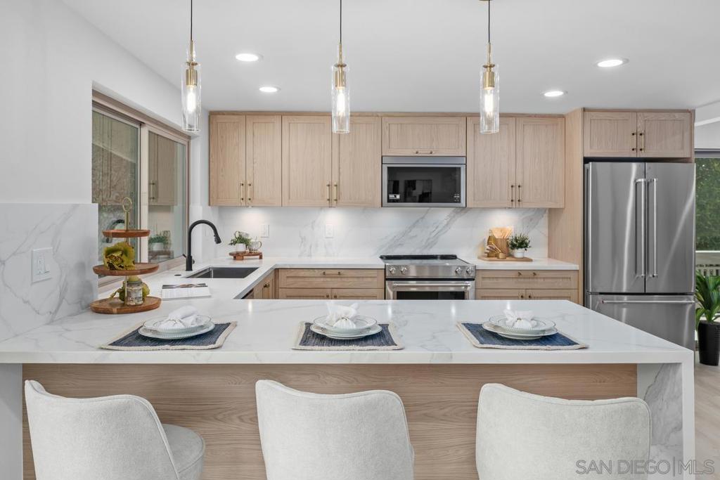 Stunningly remodeled 3BR/2.5BA 2,080 sq.ft. home tucked away at the end of a tranquil tree-lined cul-de-sac on the East Side of Mount La Jolla. This prime location has an expansive greenbelt at your backdoor— offering unmatched privacy and tranquility. The gorgeous remodeled open-concept kitchen features brand new appliances and quartz countertop with waterfall edge. Enjoy the large dining/family area and separate living room with fireplace. Beautiful luxury plank flooring throughout, fresh paint, and a bright interior orientation that floods the home with natural light. Generous primary suite with tastefully remodeled en-suite bath. Central A/C. Experience tranquility while enjoying two private greenscape outdoor patios plus balcony. The Mount La Jolla community is 63 acres and has resort-style amenities with four pools (heated year round), 4 USTA night-lighted tennis courts, Club house with large party facility with full kitchen and another meeting room with fireplace. Equipped gym with additional stretching room and steam saunas. Library with children's section. Putting green. It's like living in an urban forest with walking paths and amazing tree lined streets. Private roads, great for walks! This location is minutes to La Jolla Village, La Jolla Cove, Top-Rated Schools, restaurants, shopping, Pacific Beach, Mission Bay, beaches, Boardwalk and more. This home is Ideal for families, professionals, or downsizers looking for peaceful, amenity-rich living in a prime La Jolla location. ***Concierge HOA Services Include: Spectrum TV – Platinum Level with HBO, Showtime, Two DVR Boxes including the DVR Service Fee, High Speed Internet, Free Router and Wireless Modem. All Water Usage – Inside and Outside. All Exterior Maintenance Including Roofs and Painting. Termite. Sewer and Trash. Fire and Earthquake Insurance. Landscaping and Streets - Maintenance, Gardening, and Landscaping for 63 Acres. Onsite manager and maintenance staff.