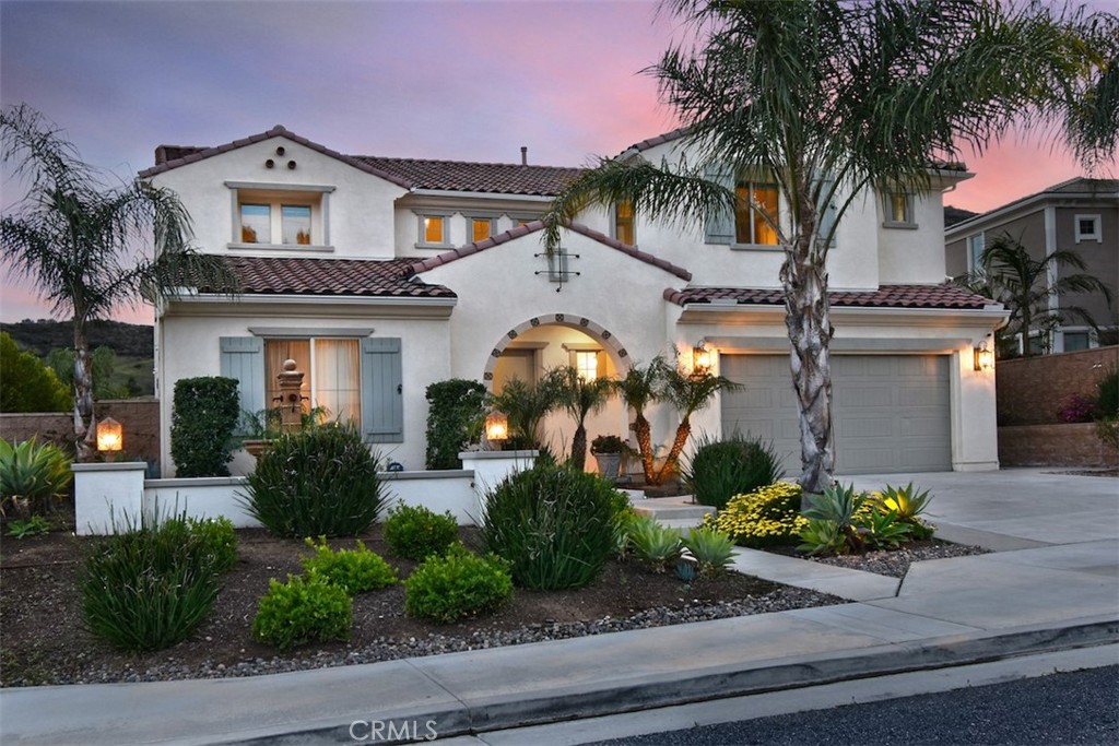 This luxurious home in the prestigious Sterling at West Hills Community is the perfect blend of elegance, comfort, and modern living. With breathtaking mountain views, it truly offers a private oasis. Boasting 5 bedrooms, 6 bathrooms, and a sprawling 4,015 square feet of living space, every inch of this home has been designed with exquisite taste and attention to detail. The main level welcomes you with a flexible office/den space, a powder room, and a formal dining room, setting the tone for a sophisticated living experience. The spacious living room features retractable sliding doors, effortlessly connecting the indoor space to the stunning backyard—ideal for entertaining. The backyard is a dream, with a sparkling pool, relaxing spa, built-in BBQ area, and cozy fire pit, creating the perfect atmosphere for gatherings. The chef’s kitchen is a culinary masterpiece, complete with an oversized island, high-end stainless-steel appliances, quartz countertops, and a large pantry. Additionally, through the kitchen is a mudroom which leads directly to a three-car garage for added convenience. The main level also features a luxurious primary suite, complete with its own washer and dryer, a spa-like bathroom, and a generous walk-in closet. Upstairs, you’ll find a spacious loft, laundry room, and four additional bedrooms, one of which has been transformed into a gym, along with four bathrooms. This home is the epitome of luxury, designed for those who seek style, convenience, and the ultimate California lifestyle.