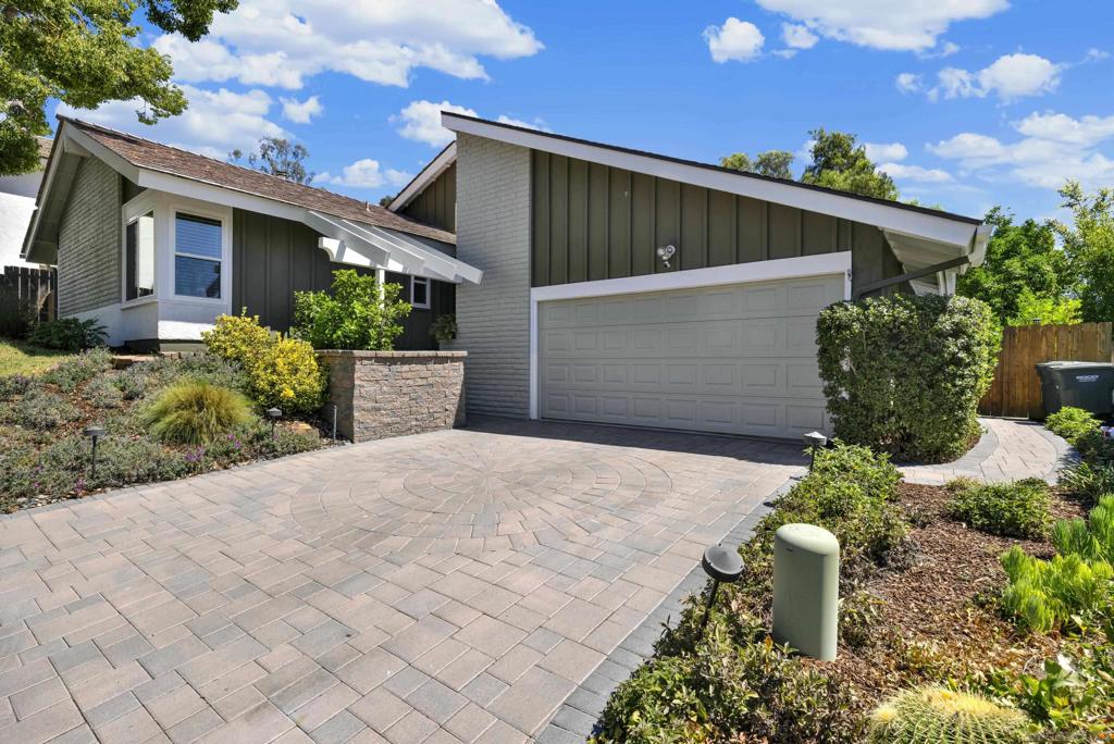 Tucked away in a quiet and private cul-de-sac in the Vineland Hills neighborhood of north Poway, this inviting home offers the perfect blend of comfort, character, and modern updates both inside and out. Complete with a private backyard, jetted spa, built-in BBQ, stamped concrete patio, lovely patio cover, designated dining area, and private brunch buffet section off dining room for the perfect outdoor brunch area. Owned solar (2015) and dual-pane vinyl windows bring peace of mind and efficiency, while thoughtful upgrades, such as newer flooring in the bedrooms, tasteful interior paint colors throughout, and a freshly painted exterior (2024) make this property move-in ready. Step inside to find soaring ceilings in the entry and main living areas, an anchoring gas-burning fireplace that creates a centerpiece for gatherings and community., and lively flooring that enhances the light, open feel. The primary suite features stylish finishes throughout, vaulted ceilings, and a generously upgraded primary bathroom, complete with walk-in closet with organizers and dual vanities. The elegant floorplan is defined by soaring ceilings in the entry and main living areas, filling the home with natural light and creating a spacious, open atmosphere. The laundry room is conveniently located adjacent to the bedrooms, with plenty of storage areas. The backyard is a peaceful escape from the hustle and bustle of everyday life. Fruit trees—including pomegranate, orange, and kumquat—offer a touch of charm and seasonal harvests in the backyard. Vineland Hills is notorious for its serene-like settings, complete with lush walking paths, pickleball/tennis courts, and a sparkling pool. This home is nestled in a fabulous location with walking trails mere seconds from its front door, guest parking close by, and Valle Verde Park minutes away on foot. With its serene setting, desirable upgrades, and secluded neighborhood feel, this home is a rare opportunity not to be missed. Nearby all the best schools in Poway Unified School District and shopping, this serenely designed home is a unique find in today’s market.