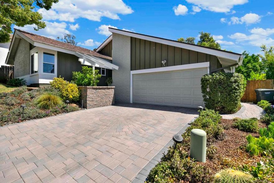Tucked away in a quiet and private cul-de-sac in the Vineland Hills neighborhood of north Poway, this inviting home offers the perfect blend of comfort, character, and modern updates both inside and out. Complete with a private backyard, jetted spa, built-in BBQ, stamped concrete patio, lovely patio cover, designated dining area, and private brunch buffet section off dining room for the perfect outdoor brunch area. Owned solar (2015) and dual-pane vinyl windows bring peace of mind and efficiency, while thoughtful upgrades, such as newer flooring in the bedrooms, tasteful interior paint colors throughout, and a freshly painted exterior (2024) make this property move-in ready. Step inside to find soaring ceilings in the entry and main living areas, an anchoring gas-burning fireplace that creates a centerpiece for gatherings and community., and lively flooring that enhances the light, open feel.  The primary suite features stylish finishes throughout, vaulted ceilings, and a generously upgraded primary bathroom, complete with walk-in closet with organizers and dual vanities. The elegant floorplan is defined by soaring ceilings in the entry and main living areas, filling the home with natural light and creating a spacious, open atmosphere. The laundry room is conveniently located adjacent to the bedrooms, with plenty of storage areas. The backyard is a peaceful escape from the hustle and bustle of everyday life. Fruit trees—including pomegranate, orange, and kumquat—offer a touch of charm and seasonal harvests in the backyard. Vineland Hills is notorious for its serene-like settings, complete with lush walking paths, pickleball/tennis courts, and a sparkling pool. This home is nestled in a fabulous location with walking trails mere seconds from its front door, guest parking close by, and Valle Verde Park minutes away on foot. With its serene setting, desirable upgrades, and secluded neighborhood feel, this home is a rare opportunity not to be missed. Nearby all the best schools in Poway Unified School District and shopping, this serenely designed home is a unique find in today’s market.