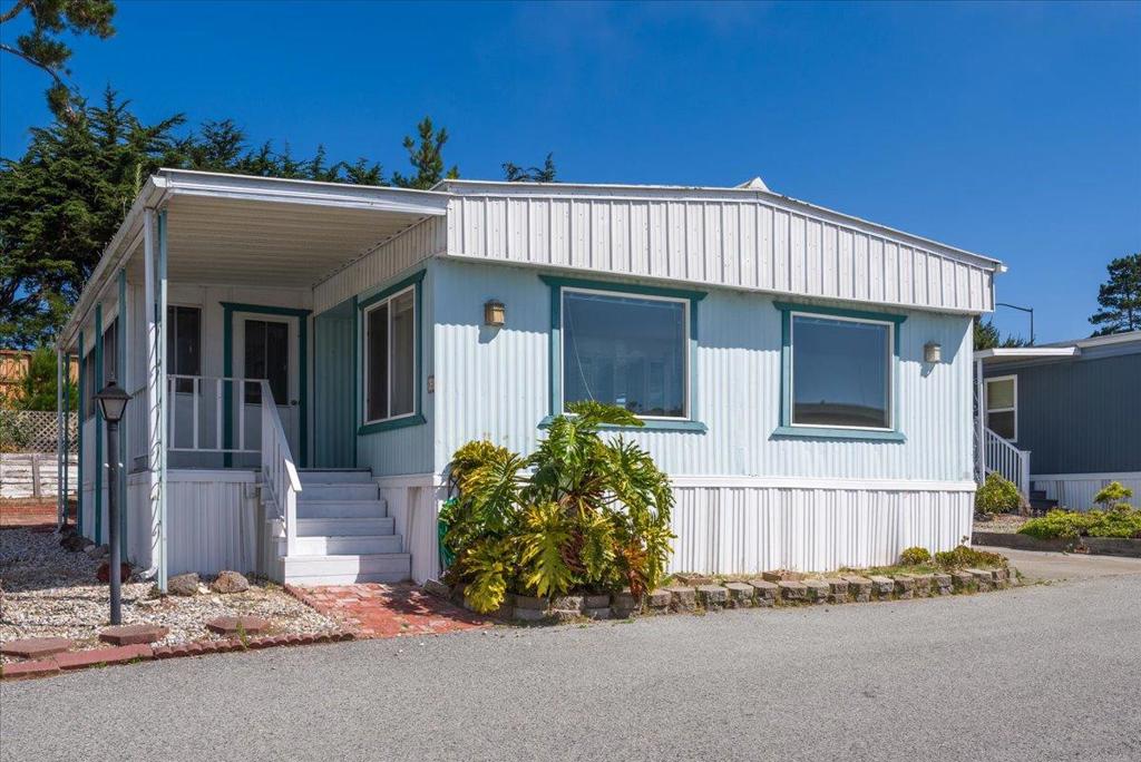 Welcome to 52 Oceanview Avenue, a spacious two-bedroom, two-bathroom double-wide mobile home located in the Canada Cove 55+ Community. Offering 1,440 square feet of living space, the home presents an ideal canvas featuring a versatile floor plan in a prime coastal setting. The expansive living room is combined with a large dining area and features a built-in storage cabinet. The kitchen includes a large island with ample counter space, pantry, and easy to maintain tile floors. Just off the kitchen is a unique workshop area - perfect for additional storage, hobbies, or even converting to a cozy entertaining space. This home offers two spacious bedrooms, including a primary suite with an en-suite bathroom, and a second bedroom perfect for guests or a home office. Additionally, you'll find a convenient laundry room with a washer and dryer, along with a handy storage shed ideal for gardening tools or outdoor equipment. Offering a fantastic opportunity to personalize and design a space that perfectly suits your style, the exceptional location only adds to its appeal. With Ocean Colony just moments away and easy access to Highway 1 and 92, you can enjoy the best of both worlds - close proximity to the beach, shopping, dining, and quick commutes to the Peninsula.