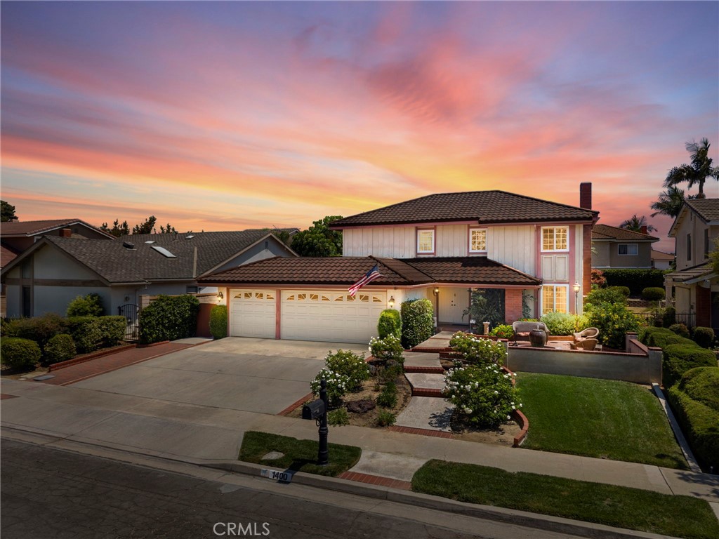 THIS HOME IS A MUST SEE! Beautiful home located in the highly sought-after neighborhood in Fullerton! This home features a bright and open floorplan with 4 bedrooms, 2.5 bathrooms with 2,369 square feet of spacious living space. Beautiful front porch sitting area with fountain, lighting and is wired for Christmas lighting display. Upon entering, you are greeted by the sunken living room which features a beautiful fireplace, large windows for natural lighting and is adjacent to the formal dining room. The beautifully designed kitchen includes plenty of cabinetry for storage, stainless steel appliances, double ovens, electric cooktop, recessed lighting, casual dining area and is open to the family room which makes it great for entertaining. Upstairs showcases a spacious Primary Suite that includes a spacious bedroom area with mirrored closet area, two sink vanities, and a walk-in shower. Down the hall, there are three additional generously sized bedrooms which offer plenty of closet space, and a beautiful hall bathroom with a shower/tub combo. The Private backyard is beautifully designed with a large, covered patio area, beautiful mature landscaping including a beautiful orange tree and a side patio area with a gas line for a BBQ. Additional features of the property include 3 car garage, inside laundry room, beautiful hardwood flooring throughout, porcelain tile, steel roof, updated windows, copper plumbing, crown molding throughout, and updated HVAC. Located close to the Award-Winning Sunny Hills High School and Fisler Elementary K-8. Close to Emery Park, Los Coyotes Country Club, Restaurants, Shopping and so much more! Come view this beautiful home and make it yours today!