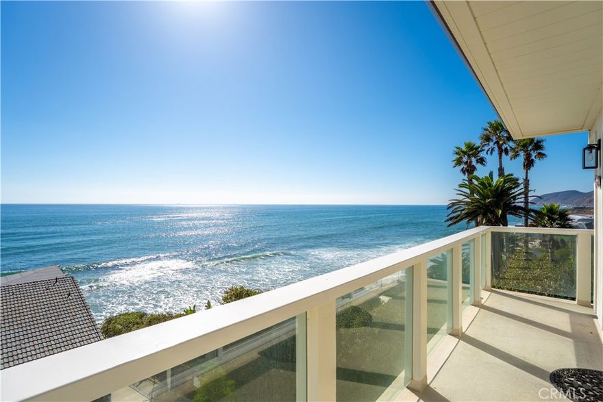 Welcome to  Malibu Bay Club located on an oceanfront bluff offering one of the most serene and coveted beach lifestyles in Malibu. Completely rebuilt in 2025, and known for its private coves, sweeping coastline, and natural beauty, this enclave is a true ocean lover’s paradise just steps from the sand. This residence offers 2 bedrooms, 2 bathrooms, and a legally expanded floor plan now approximately 1,375–1,475 square feet, making it uniquely larger than most units in the community. Rebuilt from the ground up, the home features an open concept layout with soaring ceilings, skylights, walls of glass, and sliding doors that frame endless ocean views. The spacious kitchen flows seamlessly into the dining and living areas, creating a light filled space perfect for both relaxation and entertaining. In addition to the bedrooms, there is a flexible office space that could serve as a 4th bedroom if desired. Step out to the expansive deck and take in unobstructed coastline views stretching from County Line Beach to the Channel Islands, with two of Malibu’s most popular surf breaks just outside your door. Additional highlights include private laundry, A/C, ceiling fans, solar panels, and designer selected finishes throughout. Parking includes one covered carport and two additional uncovered spaces, an amenity unique to only a handful of units. The Malibu Bay Club is one of Malibu’s rare gated beachfront communities with direct beach access, a beautifully updated pool and spa, and secure entry. Recent community upgrades include new roofs, copper gutters, exterior paint, and tile work. Don’t miss the chance to call this expanded and completely renovated coastal retreat your own just in time for the Holidays.