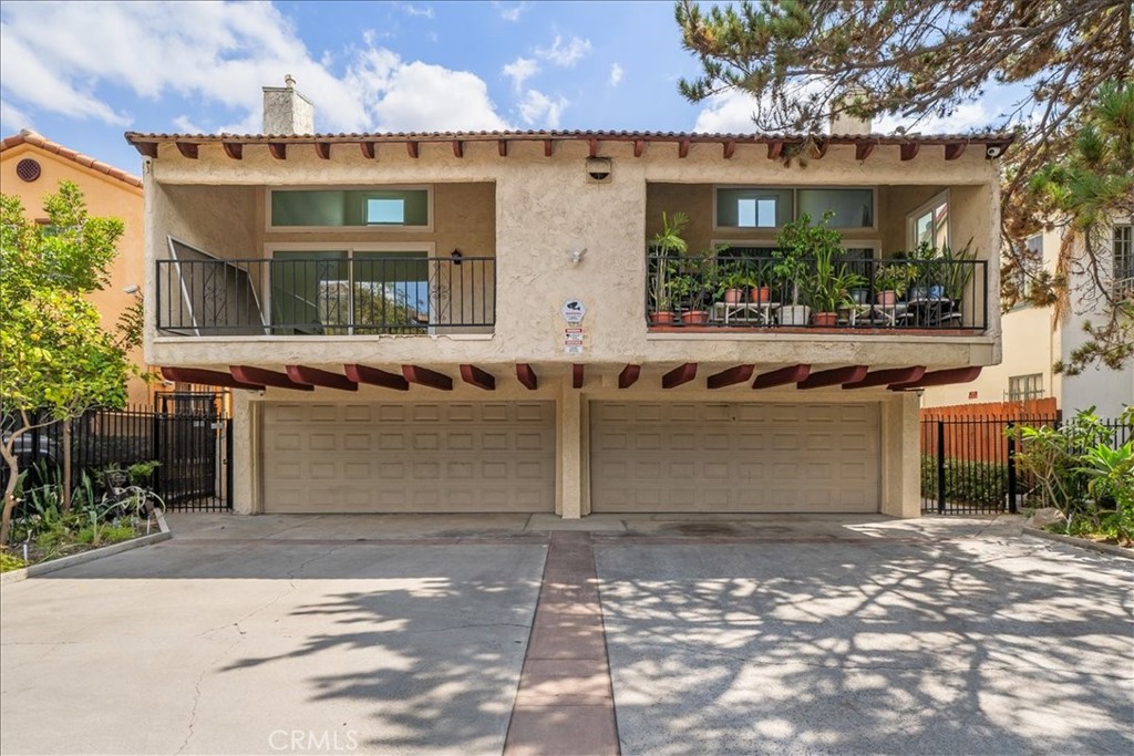 This stunning 3-bedroom, 1,897 sq ft townhome feels more like a single-family home with its private 2-car garage and direct entry. Step inside to an open, sun-filled floorplan with soaring 10-ft ceilings, skylights, and a private patio that’s perfect for relaxing or entertaining. The chef’s kitchen shines with stainless steel appliances, and brand-new finishes throughout—fresh paint, new flooring, and beautifully updated bathrooms. You’ll love the cozy fireplace, recessed lighting, central A/C, and in-unit laundry for everyday comfort. Upstairs, the oversized primary suite is your retreat with huge closets and a spa tub. The secondary bedroom is spacious enough for a king bed plus a sitting area, and the attached bath offers double sinks and tons of storage. Tucked away in the back of the community, this end unit offers extra privacy with easy garage access off 3rd Street. Low HOA dues and a prime location minutes from DTLA, Koreatown, Echo Park & Silver Lake make this home the total package!