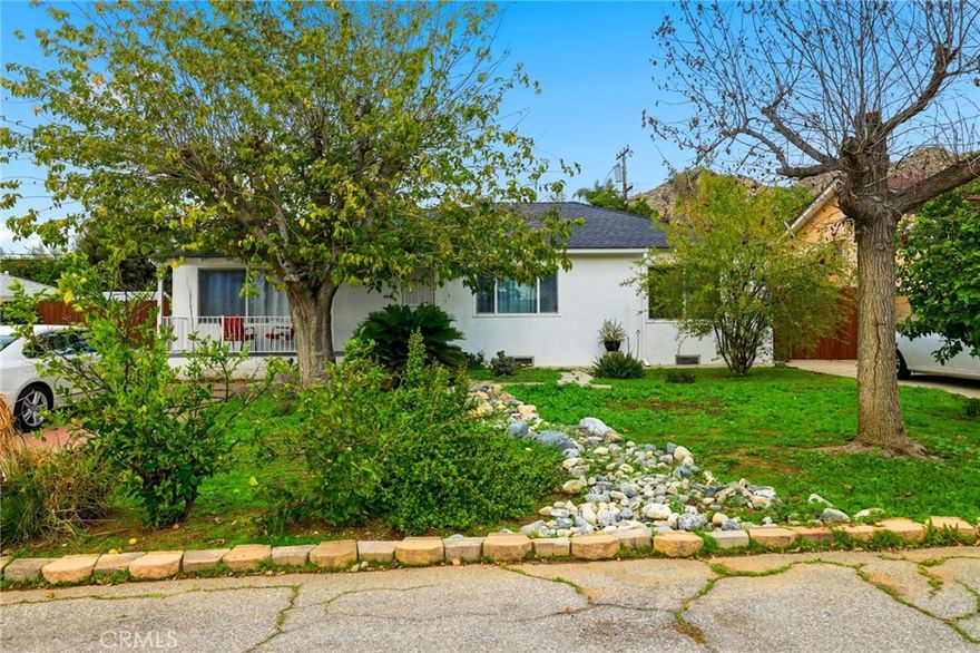 Welcome to 243 E. Blaine Street, a single-level home tucked away on a quiet cul-de-sac just one mile from the University of California, Riverside. This versatile 4-bedroom, 3-bath property offers comfortable living with flexible use options.

The main residence features 3 bedrooms and 2 bathrooms, including a primary suite, while the attached studio includes its own bedroom, full bathroom, kitchenette, and separate entrance—ideal for extended family, guests, or rental potential. Inside, find hardwood floors, a gas fireplace in the living room, a kitchen open to the dining room, and plenty of storage throughout. 

The inviting front yard is shaded by mature trees and accented by a welcoming porch. The private backyard offers a grassy area perfect for relaxing or entertaining, along with a detached garage. A long driveway provides parking for two or more vehicles, with room for an RV.

Don’t miss this well-located home, just 3 miles from downtown Riverside, with endless possibilities for today’s lifestyles.