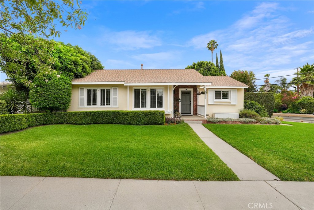 This charming single-family home on a desirable corner lot in the heart of Tarzana blends warmth, character, and thoughtful upgrades with a peaceful, private setting. From the moment you arrive, you're greeted by beautifully landscaped grounds and inviting curb appeal. Inside, rich hardwood floors, unique wall details, and soft natural light create a cozy yet elevated atmosphere. Remote-control window coverings in the common area add a luxurious, modern touch and effortless comfort. The updated kitchen features granite countertops and LG appliances, while a separate laundry area—also equipped with LG machines—adds everyday convenience. The spacious primary suite includes two closets, one of them a walk-in, for added functionality. Step into the lush backyard and discover your own private sanctuary, complete with a jacuzzi, green space, separate garden area or pet space, and a fire pit—perfect for entertaining or relaxing in total privacy. The detached garage is perfect for parking or storage, and the location is unbeatable: a friendly neighborhood just minutes from scenic hiking trails and the nearby bus line for easy commuting. This is the kind of home that feels good the moment you walk in!