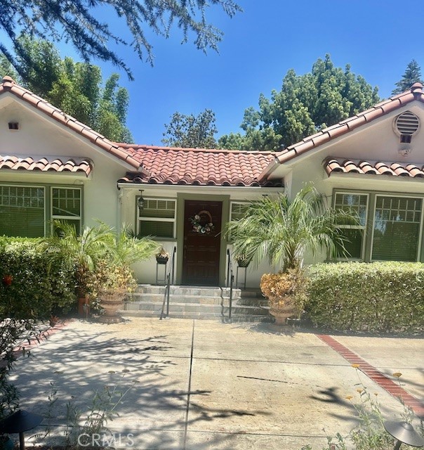 Discover this stunning 4-bedroom, 3-bathroom residence nestled on a sprawling 12,000 sq. ft. flat lot. The property features a charming circular driveway and a private gated entrance, offering both security and curb appeal. Surrounded by lush, mature trees and lush green grass, the front yard provides a perfect setting for outdoor entertaining and relaxation.
Inside, the home boasts soaring 9-foot ceilings that create an open and airy atmosphere. The formal living room, complete with a cozy fireplace, offers an inviting space for gatherings, while the elegant formal dining room is ideal for hosting dinners. The gourmet kitchen is a chef’s dream, featuring granite countertops, a large granite island, and stainless steel appliances—perfect for both everyday living and entertaining guests.
The spacious master suite includes a generous walk-in closet and a luxurious retreat. French doors lead from the master bedroom to a magnificent covered patio, seamlessly connecting indoor comfort with the stunning backyard. The beautifully landscaped yard provides a tranquil backdrop for outdoor activities, gardening, or simply enjoying the serenity of nature.
This exceptional home combines elegance, functionality, and outdoor beauty—an ideal sanctuary for comfortable living and memorable entertaining.
Washer & Dryer is excluded and not for sale. THE PROPERTY IS SOLD AS-IS.
