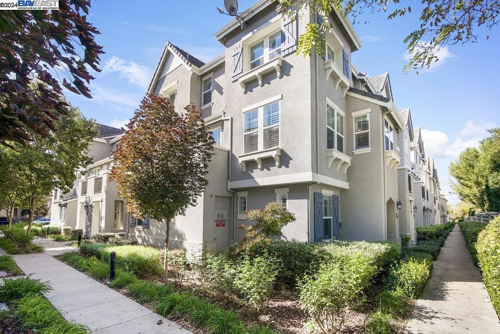 Discover this beautifully upgraded home nestled in the Montage community. This tri-level condo boasts two bedrooms, a loft, and 2.5 baths, with upgrades like Protek waterproof LVP flooring, Graber plantation shutters, and custom closets. The freshly painted interior includes dual-pane windows, dual-zone heating and A/C, a tankless water heater, recessed LED lighting, ceiling fans, and dual smoke/CO detectors. The first floor features a bedroom with an en-suite bath, laundry with a new washer, and access to the attached 2 car tandem garage with overhead racks and a new door and motor. The second floor offers seamless living with a gourmet kitchen equipped with granite countertops, stainless steel appliances, a new microwave, new garbage disposal, and a walk-in pantry. The dining and living areas open to a private balcony, with the living room wired for surround sound. On the third floor, find the loft and master suite with a walk-in closet and en-suite bath. Amenities include a pool, spa, gym, clubhouse, playground, and picnic area. HOA covers exterior maintenance, hazard insurance, and water. Conveniently located near Silicon Valley, with quick access to vineyards, lakes, trails, and shopping.