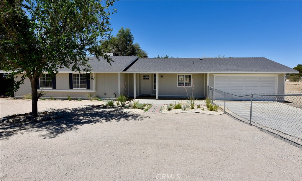 Beautifully Renovated Lancaster Ranch Home with Modern Finishes and Room to Grow. Move-in ready and thoughtfully updated, this single-story, 3-bedroom, 2-bathroom ranch-style home offers the perfect blend of comfort, design, and usable outdoor space on a flat, fully fenced 0.67-acre horse-zoned lot. The home features 1,357 sq ft of bright and functional living space with vaulted ceilings, luxury vinyl plank flooring throughout, and French doors that open to a spacious backyard with a covered patio—ideal for relaxing, entertaining, or expanding your lifestyle outdoors.
The fully renovated kitchen includes GE stainless steel appliances (gas range with crisp mode, microwave, and dishwasher), Carrara white quartz countertops with an under-mount sink, shaker-style cabinetry, a gooseneck faucet, and recessed lighting. Both full bathrooms have been modernized with seamless acrylic tub/shower combos, new vanities and fixtures, marble-look porcelain floor tiles, and solid-surface counters.
The primary suite features a walk-in closet, French doors that open to the yard, and a private en suite bath. A second bedroom also features a walk-in closet. Additional upgrades include all new doors, baseboards, trim, electrical fixtures, decorator-style outlets and switches, fresh two-tone paint, and newly installed smoke detectors.
Recent exterior updates include: Brand-new roof (full replacement); Xeriscape-style landscaping with drought-tolerant plants, decomposed granite, and drip irrigation; Two sets of French doors; New roll-up garage door with automatic opener; Fresh exterior paint and lighting; and Gated RV/vehicle access and horse-zoning (buyer to verify ADU potential).
Central heat and air, a two-car garage with laundry hookups, and a wood-burning fireplace complete the offering. Located minutes from schools, parks, and local amenities, this home combines thoughtful upgrades, livable design, and a large usable lot—perfect for buyers seeking value, flexibility, and peace of mind.