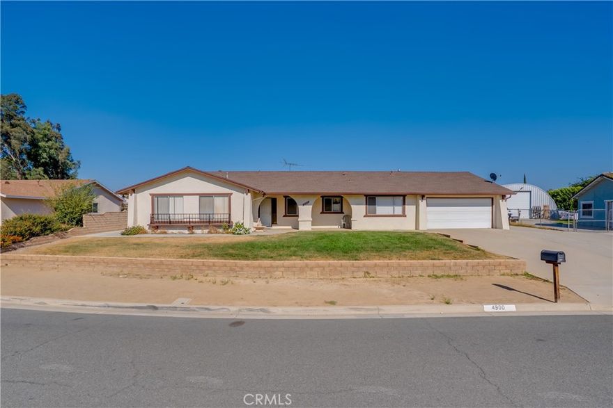 Welcome to this spacious single story ranch style home on a sprawling lot in Jurupa Valley! This property offers the perfect blend of comfort, outdoor living, and incredible potential for both family living and entertaining.



Main Home Features

5 bedrooms, 3 bathrooms, and an open, functional layout.

Bright living spaces with large front windows bringing in natural light.

Generously sized kitchen and dining areas ready for your personal touch.

Attached 2 car garage with a wide driveway and plenty of parking for guests, RVs, or work vehicles.



Lot & Outdoor Living

Expansive over 1/2 acre lot with endless possibilities.

Backyard paradise featuring a sparkling in-ground pool, perfect for sunny California days.

Huge covered patio ideal for barbecues, gatherings, or relaxing poolside.

Multiple storage sheds and a large concrete pad, perfect for workshops, extra storage, or small business use.

Large open yard space ready for gardening, additional structures, or outdoor recreation.

With no HOA, this spacious lot has excellent potential as a horse property or hobby farm.



Location Highlights

Conveniently located near major freeways for an easy commute.

Minutes from shopping, schools, parks, and equestrian trails.

Enjoy the privacy of a larger lot while still being close to city amenities.



This home is a rare find in Riverside County, combining a traditional single story layout with a resort style backyard and plenty of usable land. Whether you’re looking to create a family retreat, a hobby farm, or just need extra space, this property checks all the boxes!



Don’t miss the opportunity to own this unique Jurupa Valley gem. Schedule your private showing today!