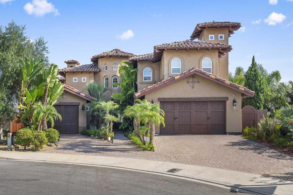 A fabulous Custom built home with 6BR 6 full baths 1 ½ BA is awe inspiring with breathtaking ocean, lagoon & golf course views from almost every room. The home design was created to capture views from every room with an open & flowing floor plan. As you enter the 30 ft turret and marvel in the open floor plan of wide archways and large exposed beams with 10' ceilings on the first floor and 9' ceilings on the second floor and the basement. Beautiful Mexican travertine enhances the first floor while distressed hard wood floors compliment the stair accented with hand painted tiles and hallways on the 2nd floor, carpet in the bedrooms. Open the wall of glass (a La Cantina Door) out to the covered lania's to enjoy the open living area while watching the inspiring sunsets or all the stunning views. Kitchen style is completed with a stunning distressed custom cabinetry in the kitchen, pantry room, Wolf appliances and incredible stone island make this kitchen one of a kind with granite and stone. Two dishwashers, a full kitchen sink and a prep sink for fabulous meal prep. This impeccable home boasts of 5665 feet, 4065 of living space on the 1st and 2nd floor and a 1600 sqft basement was completely done with a creative design. Entering the primary suite with private sitting room and personal balcony for the romantic evenings without distraction. Exquisite master bath with a stunning bathtub and shower.