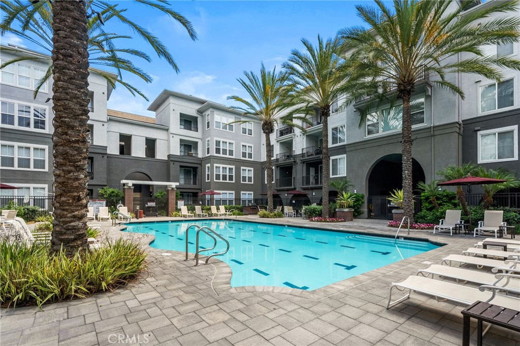 Welcome to Stadium Lofts, one of Anaheim’s most sought-after communities in the heart of the Platinum Triangle. This stylish one bedroom, one bath condominium offers a bright and open floor plan with a spacious living room, dining area, and private balcony. The kitchen features granite countertops, stainless steel appliances, and ample cabinet space, while the bedroom includes a walk-in closet and the bathroom connects seamlessly to both the bedroom and entryway. Added conveniences include in-unit laundry, central heating and air, a tankless water heater, and one assigned parking space located close to the unit. Residents of Stadium Lofts enjoy resort-style amenities including a sparkling pool and spa, sauna, modern fitness center, clubhouse, outdoor lounge areas with fire pits, barbecue stations, and beautifully landscaped courtyards. HOA fees cover high-speed internet, building insurance, common area maintenance, and HVAC filter replacement, offering excellent value and peace of mind. Secure gated access, EV charging stations, and ample guest parking add to the convenience, while the prime location places you near Angel Stadium, Disneyland Resort, Honda Center, UCI Medical Center, and endless dining and shopping options—making this home the perfect blend of comfort, lifestyle, and accessibility.
