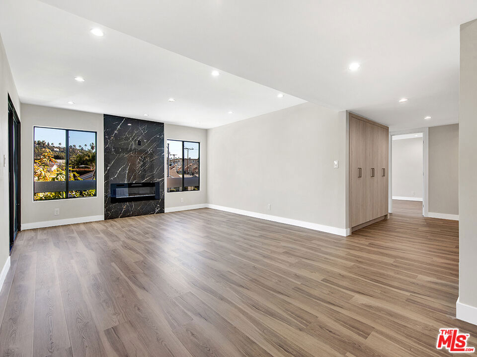 3 parking spaces offered with this remodeled condo, walking distance from Kenneth and minutes driving from shopping centers and gyms.  Offering you a unit on the second floor with an elevator.  Spacious living room, dining area, and bright and new kitchen.  Recessed lights throughout the condo, and walk into a big balcony with Glendale mountain views.  The bedrooms have new built-in closets, and top-of-the-line workmanship.  The bathrooms have been redone top to bottom, along with a walk-in closet in the master bedroom.  The community pool is there for your summer enjoyment along with a spa.  HOA dues are $425 and include water, trash, and gas.