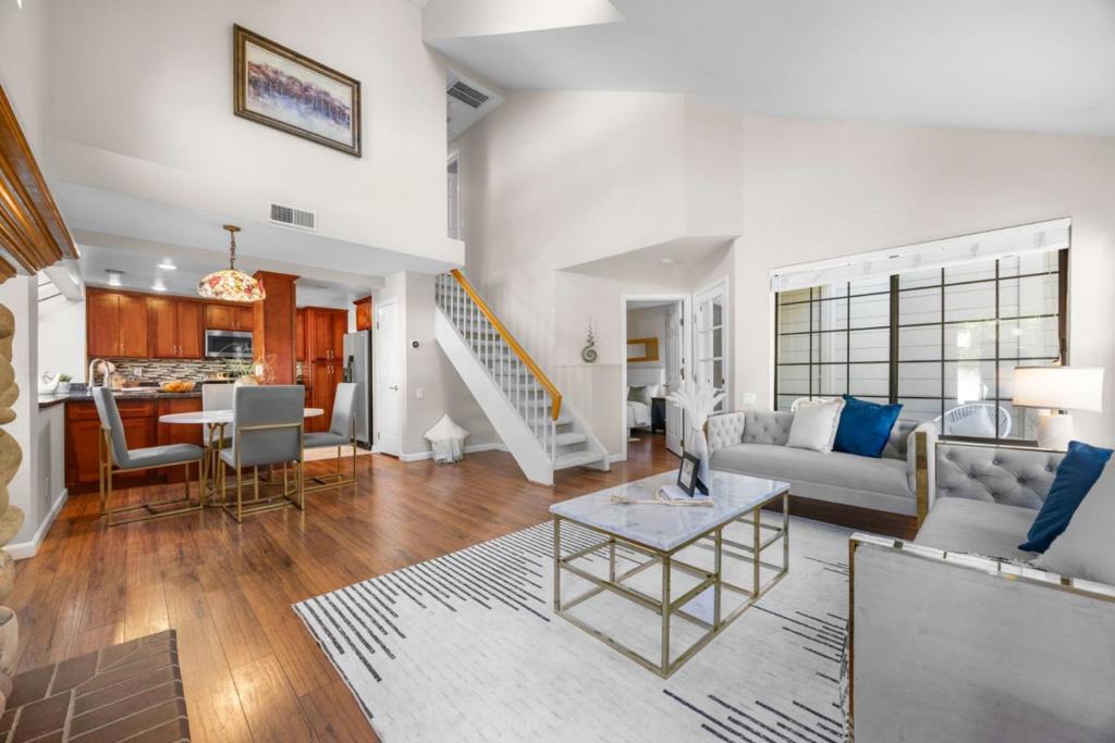 DOWNSTAIRS BED AND BATH. TALL CEILINGS. 2-STORY. LOW HOA. Beautiful end-unit home with full downstairs bed & bath, attached 2-car side-by-side garage, soaring ceilings, and abundant natural light! Located in Yerba Buena Villas in the desirable Silver Creek area, this home offers a spacious layout with a cozy living room, fireplace, recessed lighting, and serene garden views. The open kitchen and dining area feature large garden windows, granite countertops, and ample cabinet space. The main-level bed & bath is ideal for guests, multigenerational living, or a home office. Upstairs are two more spacious bedrooms and a full bath. Central A/C, dual-pane windows, and all newer stainless steel appliances included. Enjoy resort-style amenities including pool, spa, and playground in a park-like setting. Quiet interior location with plenty of guest parking and low HOA dues of $320/month. Zoned to top-rated James Franklin Smith Elementary. Close to Hwy 101, Evergreen Village Square, Silver Creek Plaza, and trails at Montgomery Hill and Falls Creek. A rare blend of comfort, function, and location!