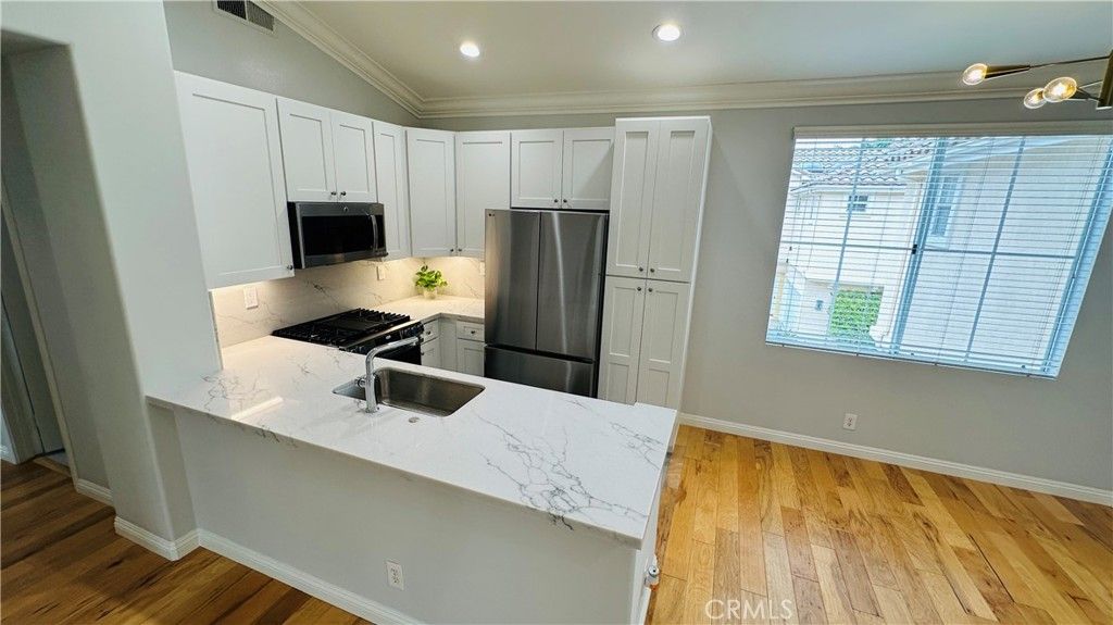 Photo of 802 Marinella Aisle, Irvine, CA 92606 (MLS # PW26067112)