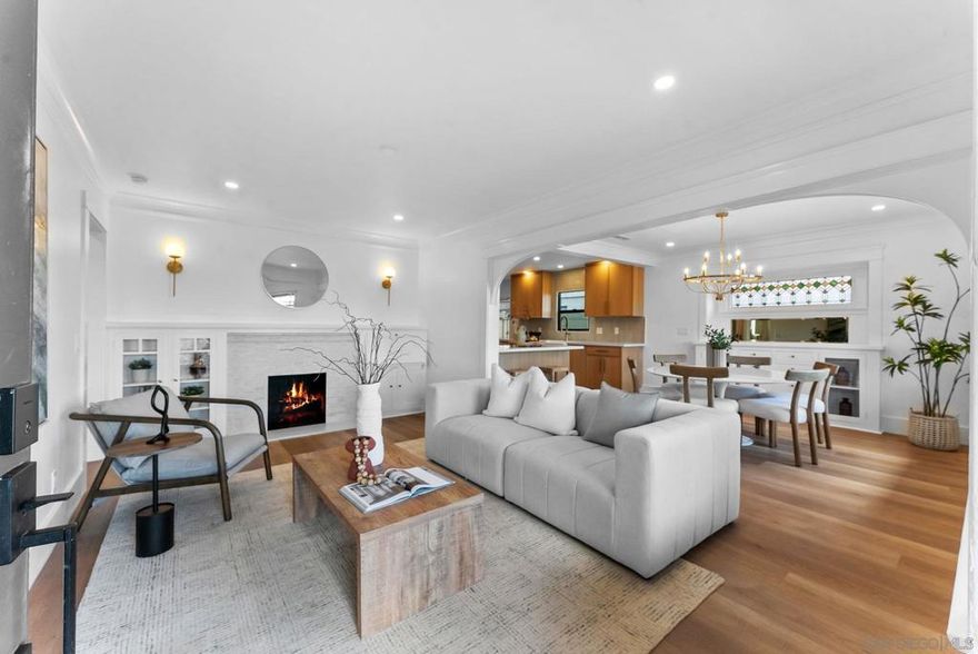 Timeless charm meets modern luxury in this beautifully renovated 4-bed, 2.5-bath 1923 Craftsman — complete with a fully equipped 1-bed, 1-bath back house ideal for multigenerational living, a home office suite, or private guest quarters. Located in one of San Diego’s most beloved historic neighborhoods, this property offers exceptional walkability and immediate access to University Heights’ vibrant restaurant, bar, and retail scene.  The main home blends thoughtful upgrades with preserved character throughout, including original wood windows, stained-glass details, and classic Craftsman architecture. With strong potential for historic designation, the home offers both charm and long-term value.  Inside, the renovation showcases custom cabinetry, high-end designer tile, and elevated finishes. The oversized primary bathroom is a true retreat, featuring a single oversized dual-sink vanity, a large walk-in shower with dual shower heads, a private water closet, and champagne bronze fixtures. The primary suite also includes a custom built-out closet for refined, functional storage. The flexible layout includes a front bedroom that works perfectly as a dedicated office or creative studio.  The property’s outdoor amenities are designed for quintessential San Diego living, offering a sparkling pool, a custom extruded-aluminum pergola, and a multifunctional rear flex space ideal for parking, lounging, or entertaining. A detached 2-car garage and alley access further enhance usability — and present a compelling opportunity for future value add through additional units or ADU expansion