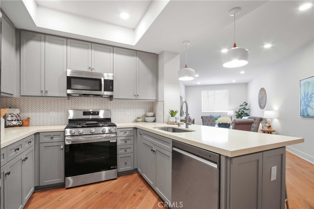 La Sevilla is a brand-new upscale collection of 75 single-level condominiums that combine comfort, simplicity, and modern living. Each home offers hardwood flooring throughout, and a private balcony. Residents enjoy a fitness center, remote-work lounge, community room with full kitchen and pool table, plus a BBQ area with firepit.
Plan A - This single-level floorplan offers a well-designed one-bedroom, one-bathroom layout. The open-concept living and dining area extends to a private balcony, creating a seamless indoor-outdoor living experience. Interior finishes include wide-plank hardwood flooring throughout, quartz counters, full tile backsplash, and a premium Stainless Steel LG appliance package (French-door fridge, built-in microwave, gas range with AirFry, dishwasher). The bedroom includes a walk-in closet. Bathrooms feature glass-enclosed showers, quartz counters, designer porcelain tile, and stainless-steel accents.
Nestled on the Palos Verdes Peninsula, La Sevilla offers the tranquility of a high-end neighborhood alongside true walkability. Just steps away are Peninsula Center shops, the public library, grocery stores, coffee shops, and local restaurants—no freeway needed.
