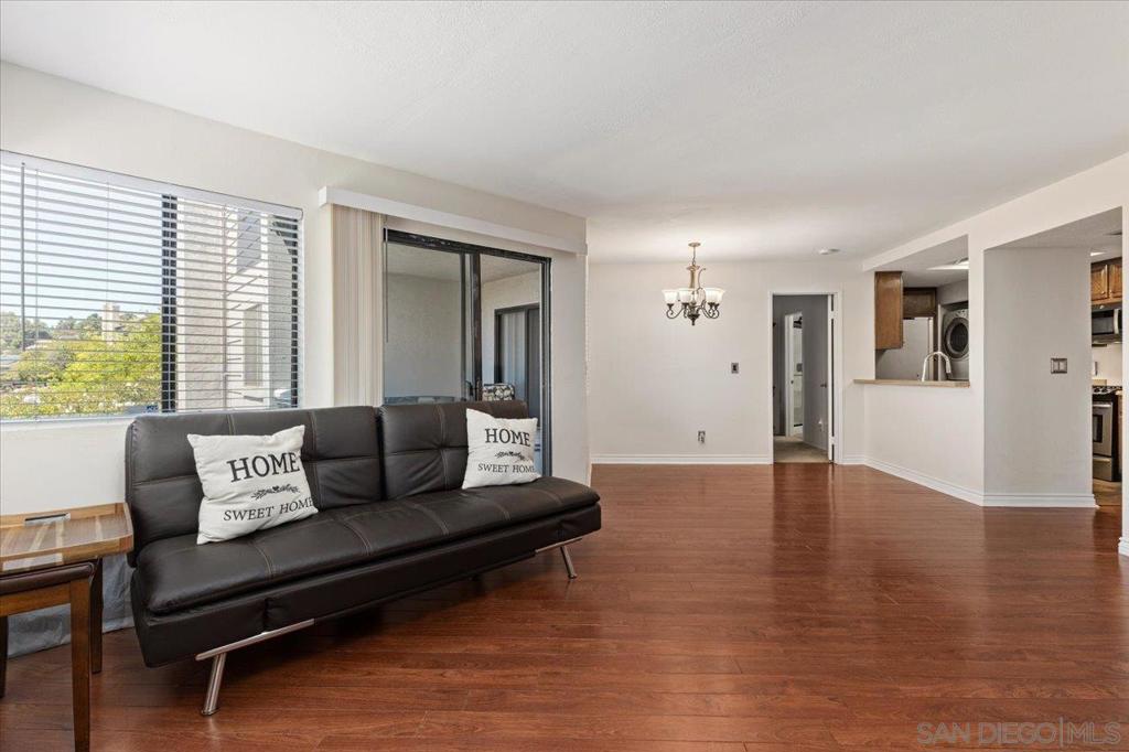 Amazing and well maintained Ranchwood home. Single story Entry Level End unit. Covered and private balcony that is shared by both Living room and Master bedroom. Offers two tennis courts, pool, spa, community park with BBQ & lush landscaping. Spacious home ready to make your own! No stairs. Central heat. Recently updated Principal Bathroom. Kitchen and bathroom flooring updated a few years ago. Stackable washer and dryer. Covered carport with one assigned parking. Additional resident parking available. Near Sweetwater Reservoir & Regional Park. Soon Nine acres Calavo Park. This Community has it all. Rancho San Diego shopping close. located near freeway access to 54, 94, and 125. VA/FHA approved. No Mello Roos. Water, Trash and partial insurance included in HOA monthly Fee. Recessed lighting. dishwasher, stove, refrigerator, stackable washer/dryer. Brazilian cherry Kitchen countertop. Redwood laminate flooring. Newly updated tiled primary bathroom, with glass doors. New wall paint. Chandelier lights in dining area. Led lights in kitchen area. New microwave & dishwasher. Unit comes with 1 reserved cover parking spot, and 1 uncovered parking spot, extra storage. Pet friendly complex. Water, trash and partial insurance included in HOA. Close to freeways. Rancho San Diego shopping: Target, Vons, movie theater, restaurants. Nearby schools. Well kept Community park with BBQ. Heated community pool, spa, dog park, serene walking trail, tennis courts, all well maintained.