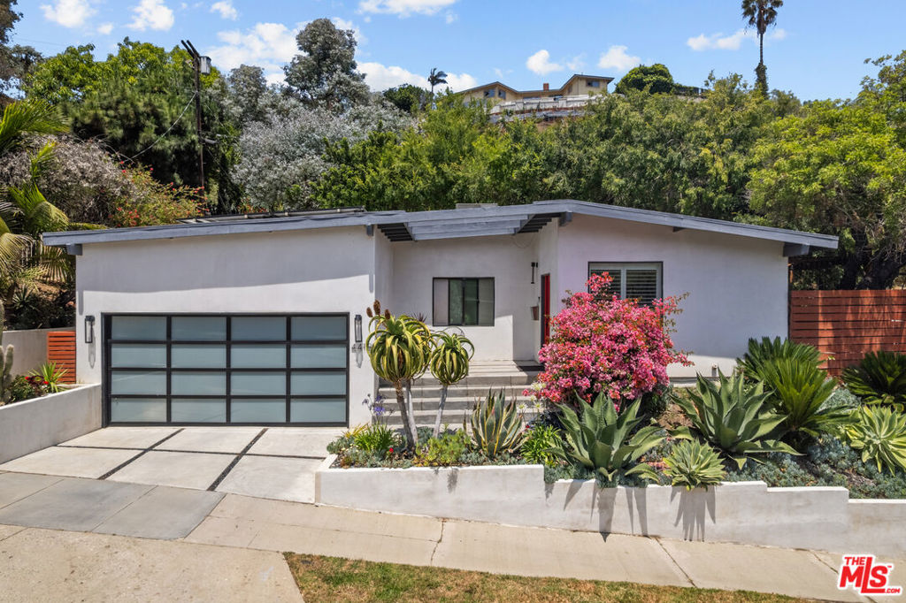 A Mid-Century Marvel in the Dons - Your Dream Home Awaits. Welcome to the perfect fusion of timeless design and modern luxury-an exceptional mid-century modern gem in the coveted Dons community of Baldwin Hills. Renovated to perfection in 2019, this sun-drenched, single-level home offers effortless living with curated finishes, dramatic ceilings, and seamless indoor-outdoor flow. Step onto the inviting front porch, ideal for morning coffee, then into an expansive open-concept living room that leads into a stylish and functional chef's kitchen. French doors open to a trellised patio, perfect for al fresco dining under the stars. The serene owner's suite features a luxurious walk-in closet, complete with a zen bathroom and two additional bedrooms offer flexibility for guests, office space, or wellness retreats. Outside, your expansive lot offers a true backyard oasis-more than just an outdoor space, it's a lifestyle. Enjoy mature avocado, lemon, and kumquat trees, a bocce ball court for friendly competition, and a cozy fire pit perfect for entertaining or unwinding under the stars. Major upgrades include: new HVAC, roof, plumbing, 200-amp electrical panel, and tankless water heater (all 2019), plus solar panels (2020). Minutes from Kenneth Hahn Park, LAX, SoFi Stadium, DTLA, the Metro, and a variety of shops and restaurants, this home offers the best of LA living. Don't miss this rare opportunity to live your California dream. Tour today before someone else is making avocado toast in your dream kitchen. Disclaimer: Touring may cause sudden urges to submit an offer and lifelong bragging rights.