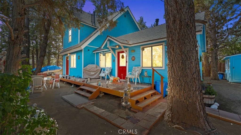 Welcome to this beautifully maintained Big Bear City split-level home on a desirable corner lot, offering the perfect blend of mountain charm and modern upgrades. Known as the “Big Blue Home,” this property showcases pride of ownership with a less than 2 year old roof, 2 year old exterior paint, and multiple updates through out to bring it up to current expectations.
Inside, the split-level floor plan offers 4 bedrooms and 2 bathrooms, with 2 bedrooms upstairs and 2 bedrooms downstairs, making it ideal for multi-generational living, a vacation getaway, or full-time residence. The upstairs features a huge primary suite with a walk-in closet, large balcony, ensuite bathroom, and direct stair access. You’ll also find a secondary bedroom and an adorable loft perfect for a reading nook or home office.
Downstairs, you’ll love the cozy living room with a wood-burning stove, cedar-planked ceilings, and a large sliding door that opens to the backyard. The updated kitchen offers stone tile countertops and a dining area, while the indoor laundry room provides an additional exterior access point. Two more bedrooms with handicap-accessible features make this home versatile and welcoming for all.
The 8400 sq. ft. lot is a rare find, with RV/boat parking, mature trees, and plenty of off-street parking. The detached two-car garage includes an attached storage/workshop with its own wood-burning stove—perfect for projects or extra storage. Whether you’re looking for a full-time mountain home, a vacation property, or an investment opportunity, this home offers space, comfort, and function in one complete package.
Don’t miss your chance to own this turn-key Big Bear City home just minutes from the lake, ski resorts, and all that Big Bear has to offer.