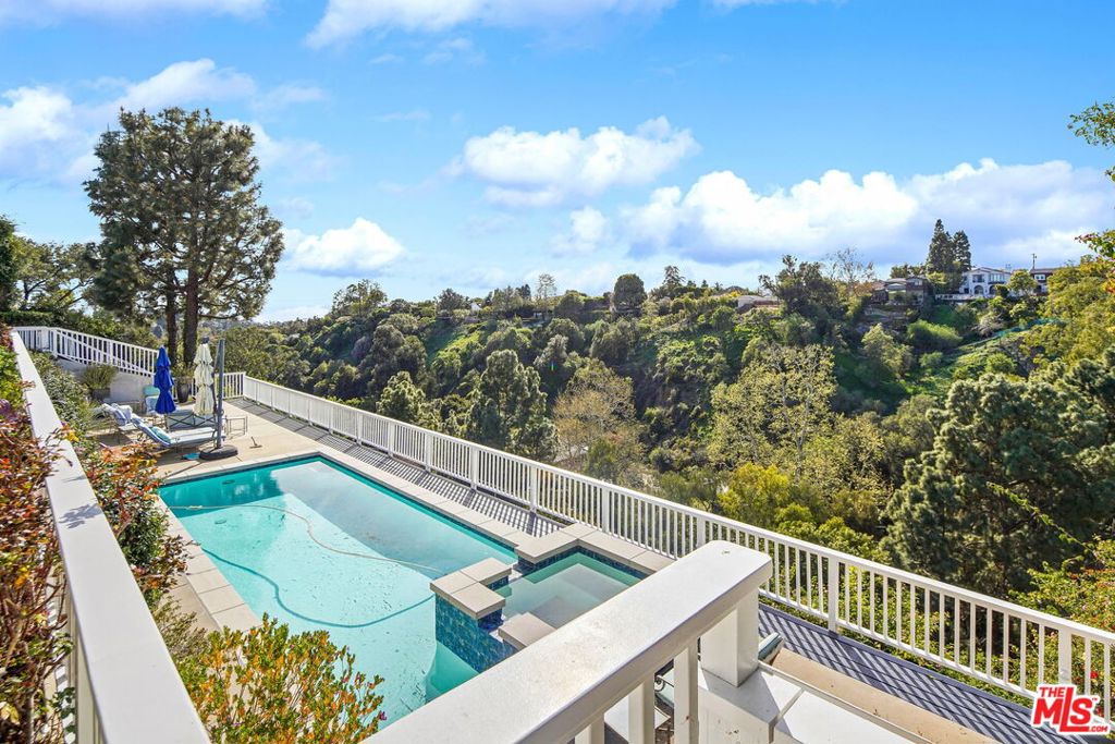 Located in the Exclusive "Will Rogers State Historic Park" neighborhood lies a very rare 13,200 square foot property with ocean and mountain views. Previous home was a traditional two story 5,373 square foot home, with a lower level pool on caissons. This is a premier location adjacent to Will Rogers Park with phenomenal hiking and equestrian trails. Only minutes to Pacific Palisades Village, and easy access to the beach and all the Palisades schools. Phase 1 and 2 have been completed, and Seller will be keeping the pool.