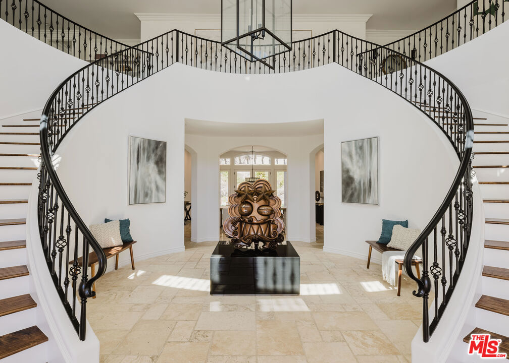 Secluded atop the hills of Park South Estates, this ultra-private, gated estate delivers in both luxury and scale. Behind double gates, this six-bedroom, eight-bathroom custom residence unfolds with grandeur soaring double-height ceilings, a sweeping dual staircase, and an entertainer's dream layout. A state-of-the-art home theater, gym with private bath, and temperature-controlled wine roomideal for showcasing vintages (maybe even from your own vineyard on property) elevate the home's allure. The chef's kitchen, outfitted with dual marble-clad islands, Wolf and Sub-Zero appliances, and a sunlit breakfast area, flows seamlessly into an expansive family room. A formal dining room and entertainer's bar set the stage for unforgettable gatherings. Upstairs, five en-suite bedrooms offer tranquil retreats, each framed by sweeping picture windows and newly reimagined baths. The primary/master suite is a sanctuary unto itself, featuring a private balcony, lounge area, dual walk-in closets, and a spa-like bath with a soaking tub, glass-enclosed shower, and panoramic vineyard views. Outdoors, resort-style living awaits: a lagoon-style pool and spa with waterfalls; sports court; putting green; and two covered patios, one with a fireplace, the other beneath a thatched-roof outdoor kitchen, with a built-in BBQ. A fire pit with wraparound seating invites evenings under the stars, while the lush hillside vineyard completes this unparalleled retreat. Four-car garage.