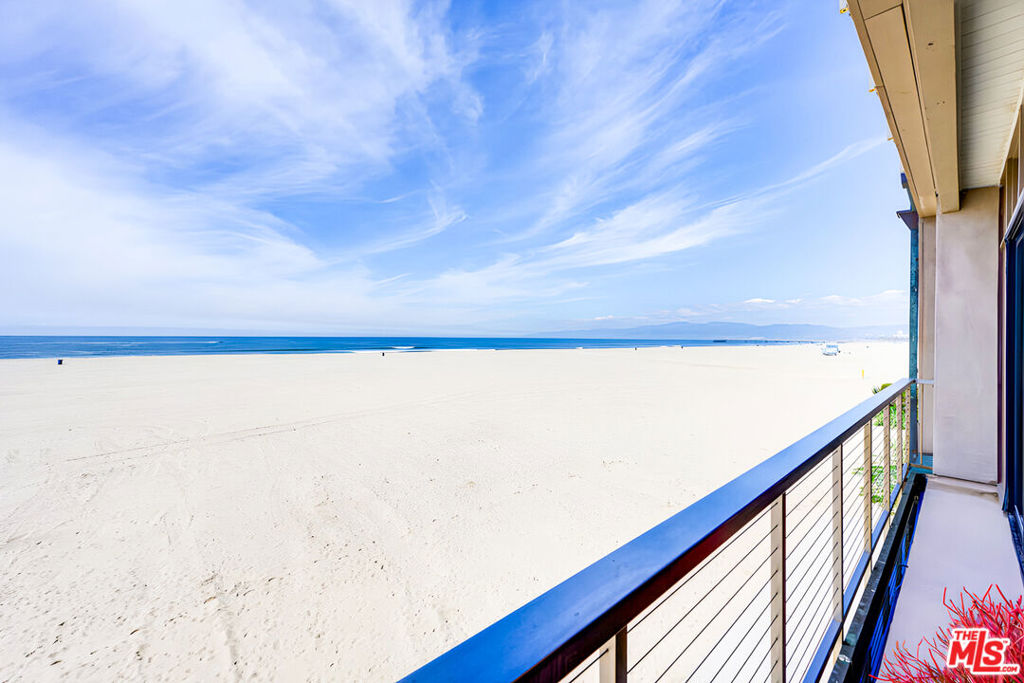 OCEANFRONT WITH 30 FEET OF FRONTAGE - LOCATED IN THE PERFECT ON THE BEST & MOST PRIVATE BEACH IN LA!!! FULLY RENOVATED TOP TO BOTTOM - This gorgeous oceanfront residence is a true gem, offering the most incredible panoramic ocean views from Catalina to Malibu! The heart of this home lies in its expansive grand space: the ultra wide living area that flows into the dining space open to a beautiful kitchen. High ceilings and wall-to-wall floor-to-ceiling glass show off mesmerizing ocean views and abundance of natural light. Private oceanfront balcony, accented with wood trim has the perfect vantage point to soak in the breathtaking views, indulge in al fresco dining, or simply relax and unwind to soothing ocean sounds, fresh air, and stunning sunsets. The primary bedroom suite features ample closet space, private outdoor space, and en-suite bathroom with a walk-in shower and dual sink vanity. The second bedroom feels like an additional primary, complete with a walk-in closet and en-suite bathroom with a luxurious soaking tub. Guest bath and laundry room are key comforts. This beachfront retreat is fully renovated with hardwood floors and high-end finishes throughout. Mostly on one level with only a few steps down to the living room. Includes 3-car garage parking and tremendous private storage great for bikes and beach gear. Situated on the highly coveted Marina Peninsula, this home provides easy access to the beach and nearby upscale dining, shopping, and entertainment! The HOA is very well funded.