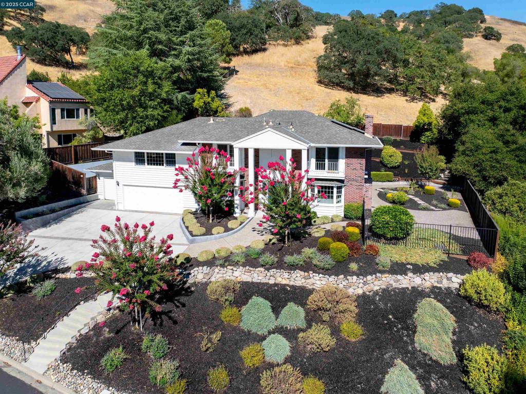 Walking distance and located within Roundhill Country Club! Spacious and private two story home on .38 acres. Refreshed and ready for a new family or owner with new landscaping, interior and exterior painting, carpet, fixtures and more. Large upstairs media room that could be used as a second family room, children's play area or other with high ceilings. Abundant storage, including an independent third garage space, currently used for a golf cart by the owner. Located towards the end of a Cul-de-sac and set back above the street, backing to open space. Dual staircases leading to the upstairs living area. Dual balconies with unobstructed views of Las Trampas hills. This is Location, Location, Location. Four bedrooms, with two family rooms, formal dining, formal living room. Lower floor Family room with custom built in cabinetry ready for your entertainment. This home is ready to be lived as it is, and/or ready for you to make it your own.