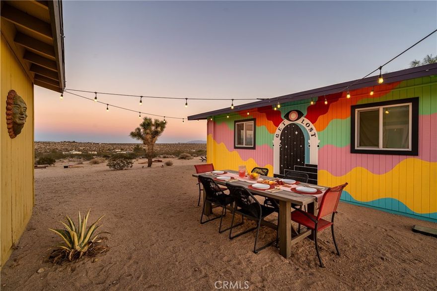 Mid-Century Modern Desert Retreat on 2.50 Acres with Mountain Views!



Welcome to your very own desert sanctuary in North Joshua Tree, where mid-century character meets modern comfort. This 2 bedroom, 2 bath home plus bonus casita sits on 2.50 acres, surrounded by sweeping mountain and desert views.



Inside, exposed wood-beamed ceilings and warm, colorful interiors capture the authentic Joshua Tree vibe, recent upgrades include a mini-split system  (heating + A/C), electrical, 80-gallon water heater, butcher block counters, and OWNED Solar bring peace of mind. Every room is designed to take in the natural beauty that surrounds you.



The detached  casita/game room expands your options, currently serving as a guest space and game room with pool table, but easily transformed into a creative studio or office. Immerse yourself outdoors to experience the best of desert living: dip into the cowboy pool by day, unwind in the jacuzzi at night beneath endless starry skies, and enjoy wide-open space all around you.



Already a highly rated Airbnb, boasting five-star reviews and the coveted Guest Favorite badge. Whether you want to continue its successful rental history or keep it as your private retreat, the property is completely turnkey and ready. Additional highlights include an EV charger, solar efficiency, and ample space for future possibilities.

Come experience Joshua Tree living at its finest, a home that’s more than just a place to live, but a lifestyle, investment, and retreat all in one. Home is 1076 sqft, Permitted Casita/Game Room 420 sqft.